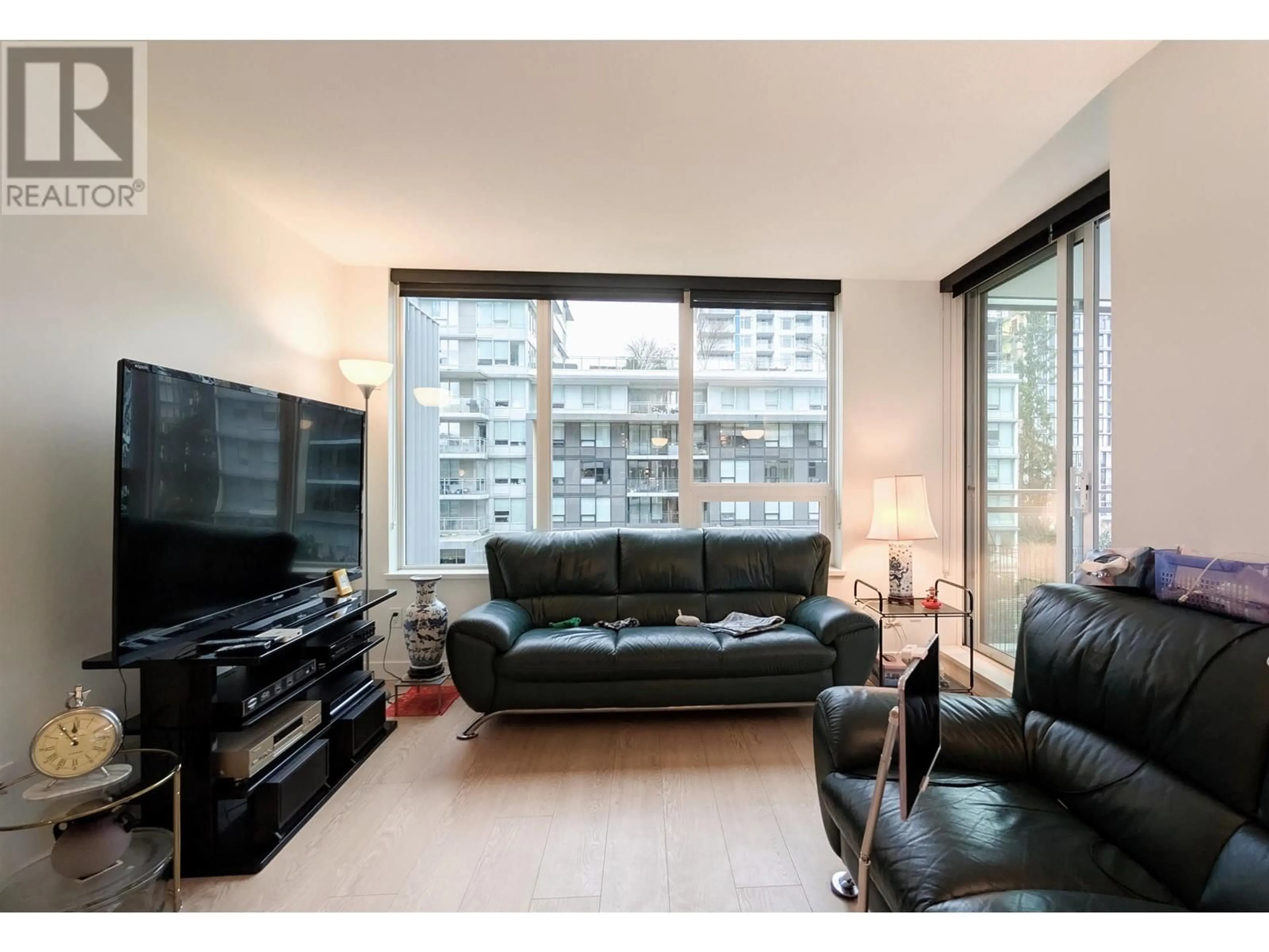 Living room with furniture, wood/laminate floor for 717 3233 KETCHESON ROAD, Richmond British Columbia V6X0R3