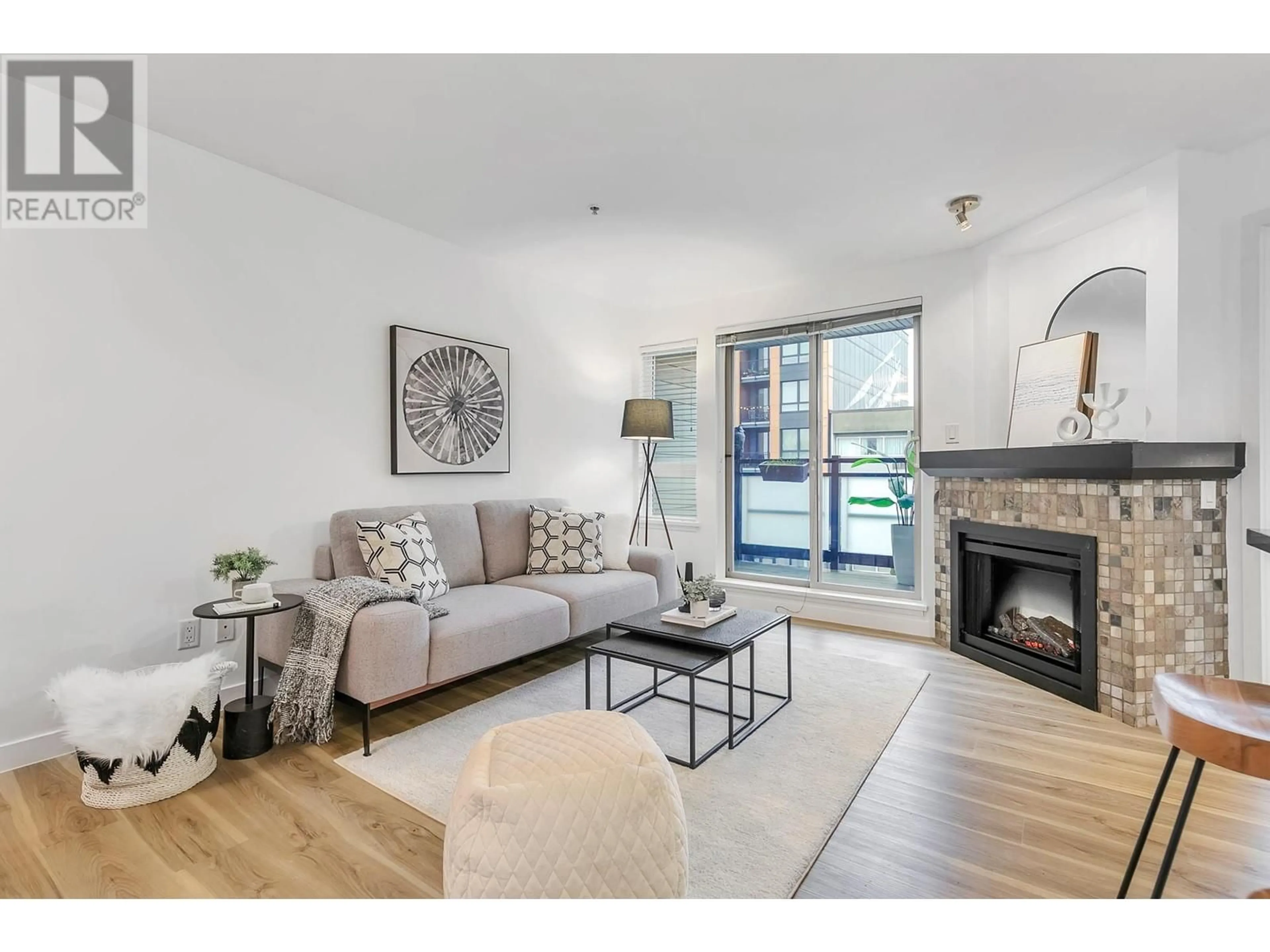 Living room with furniture, wood/laminate floor for 309 405 SKEENA STREET, Vancouver British Columbia V5K0A3