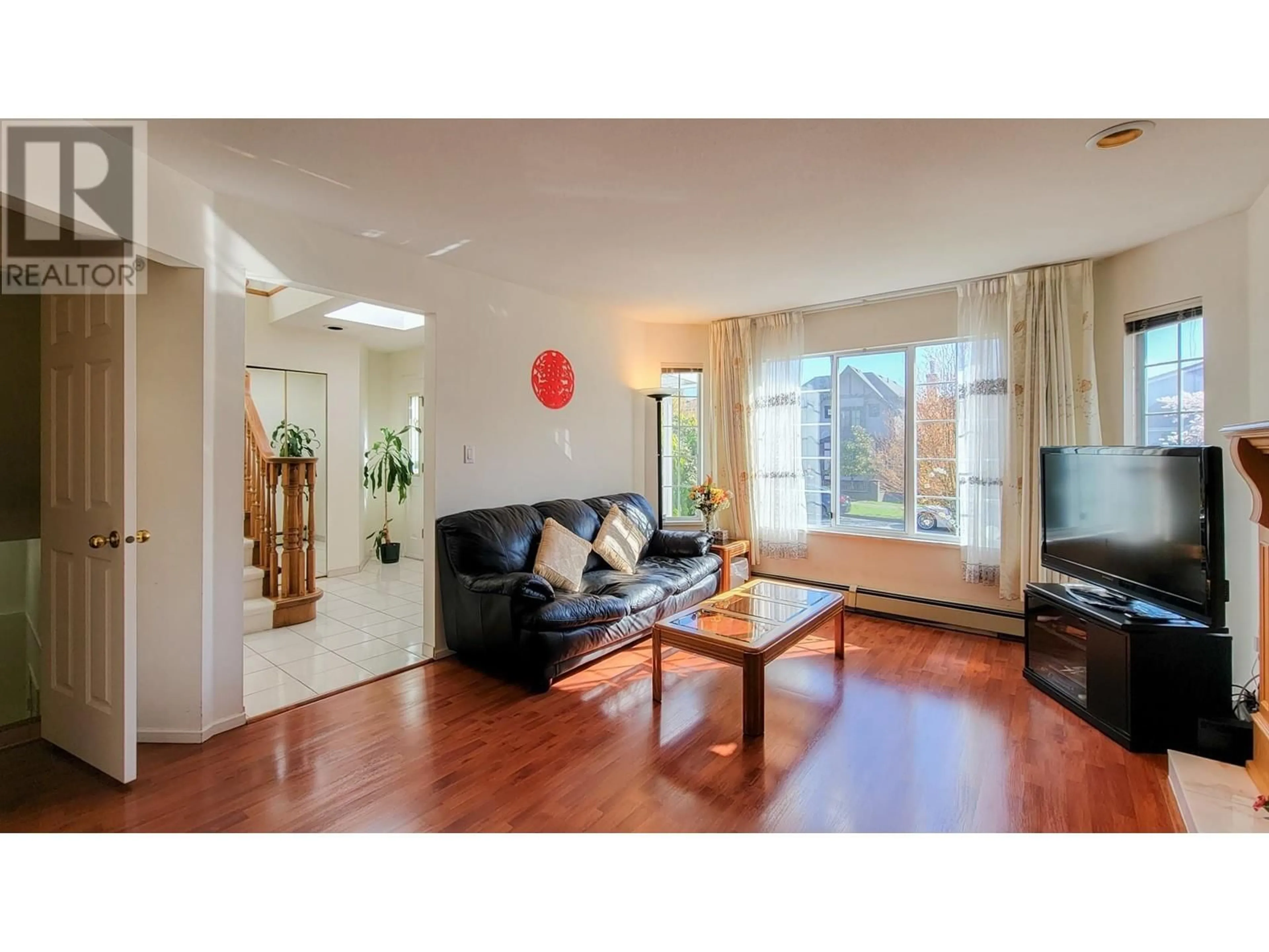 Living room with furniture, wood/laminate floor for 7607 OSLER STREET, Vancouver British Columbia V6P4C8