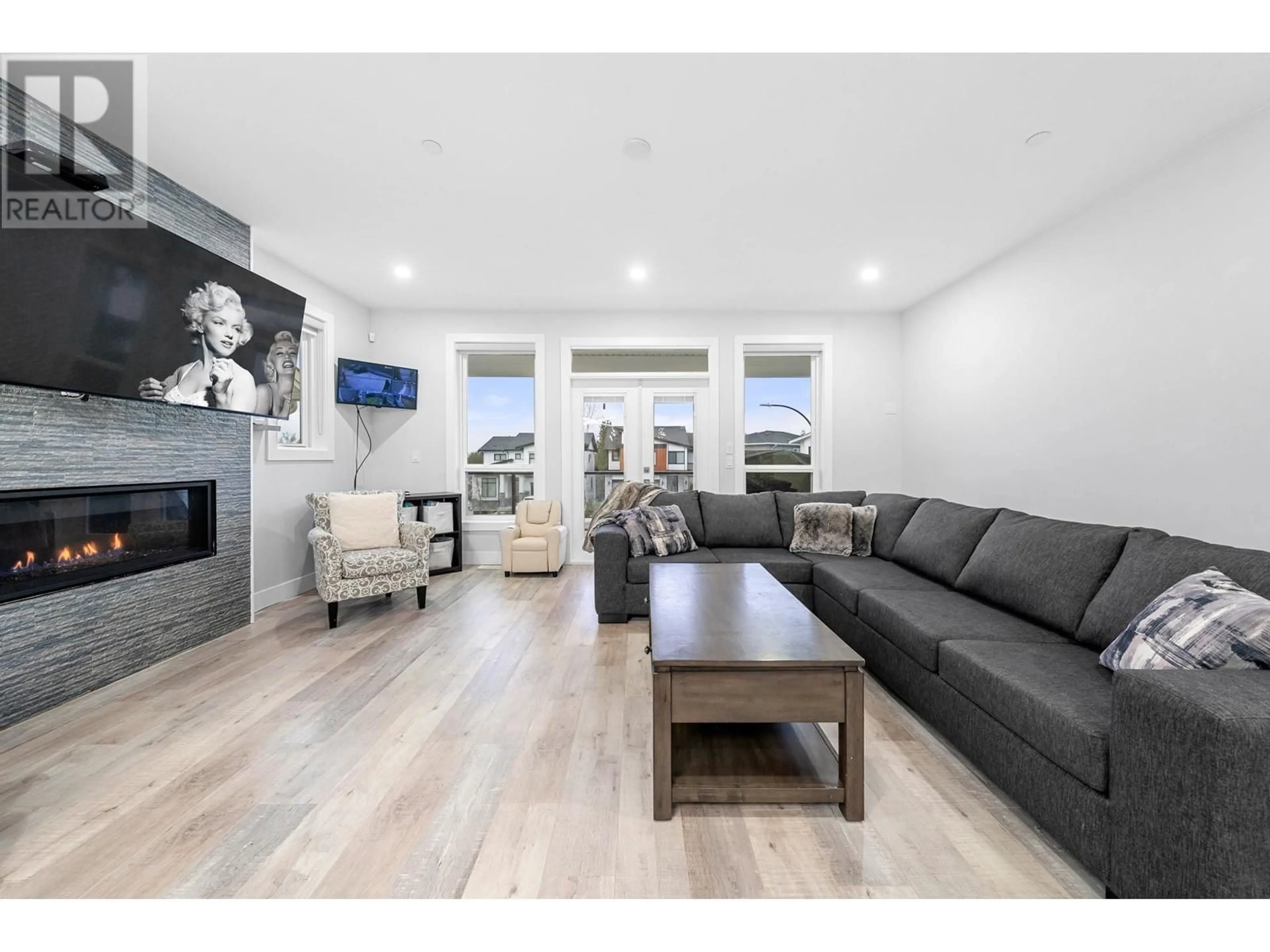 Living room with furniture, wood/laminate floor for 24629 105A AVENUE, Maple Ridge British Columbia V2W0K3