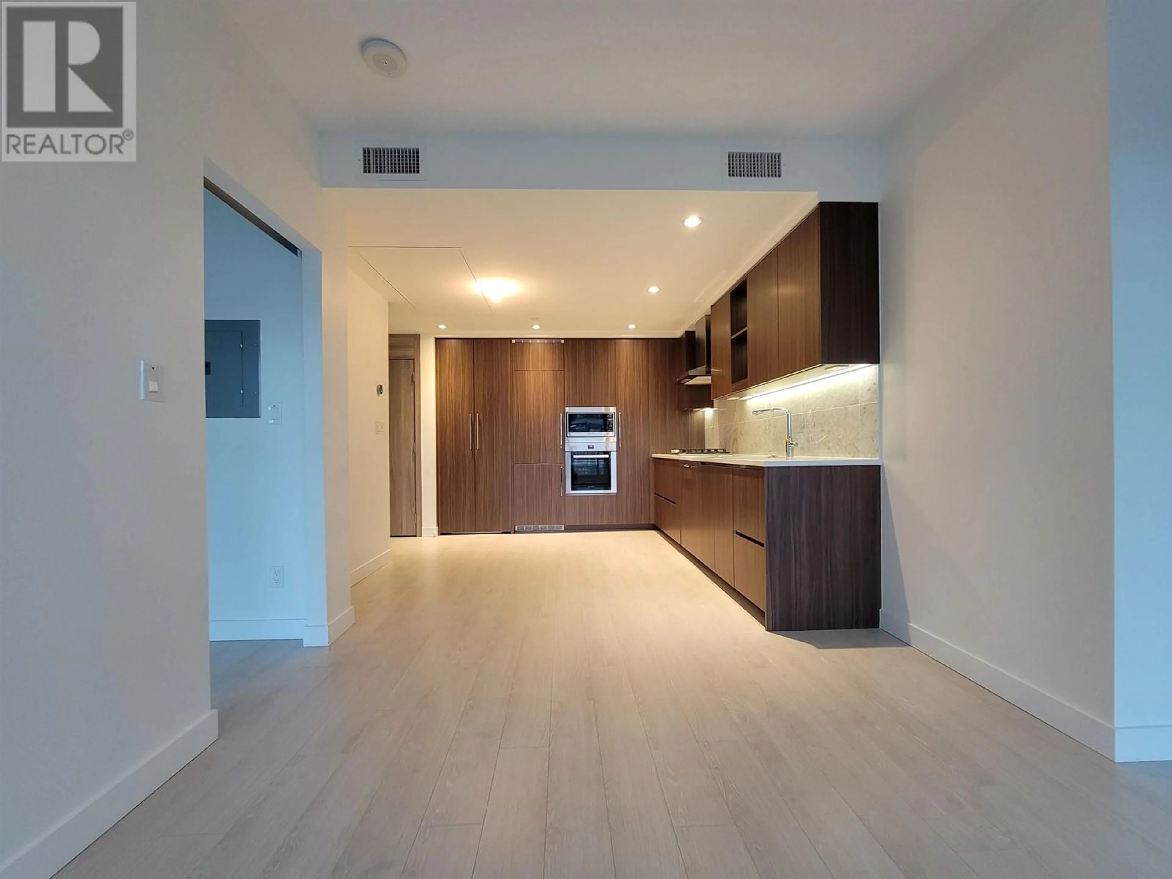 Open concept kitchen, wood/laminate floor for 508 4720 LOUGHEED HIGHWAY, Burnaby British Columbia V5C0M8