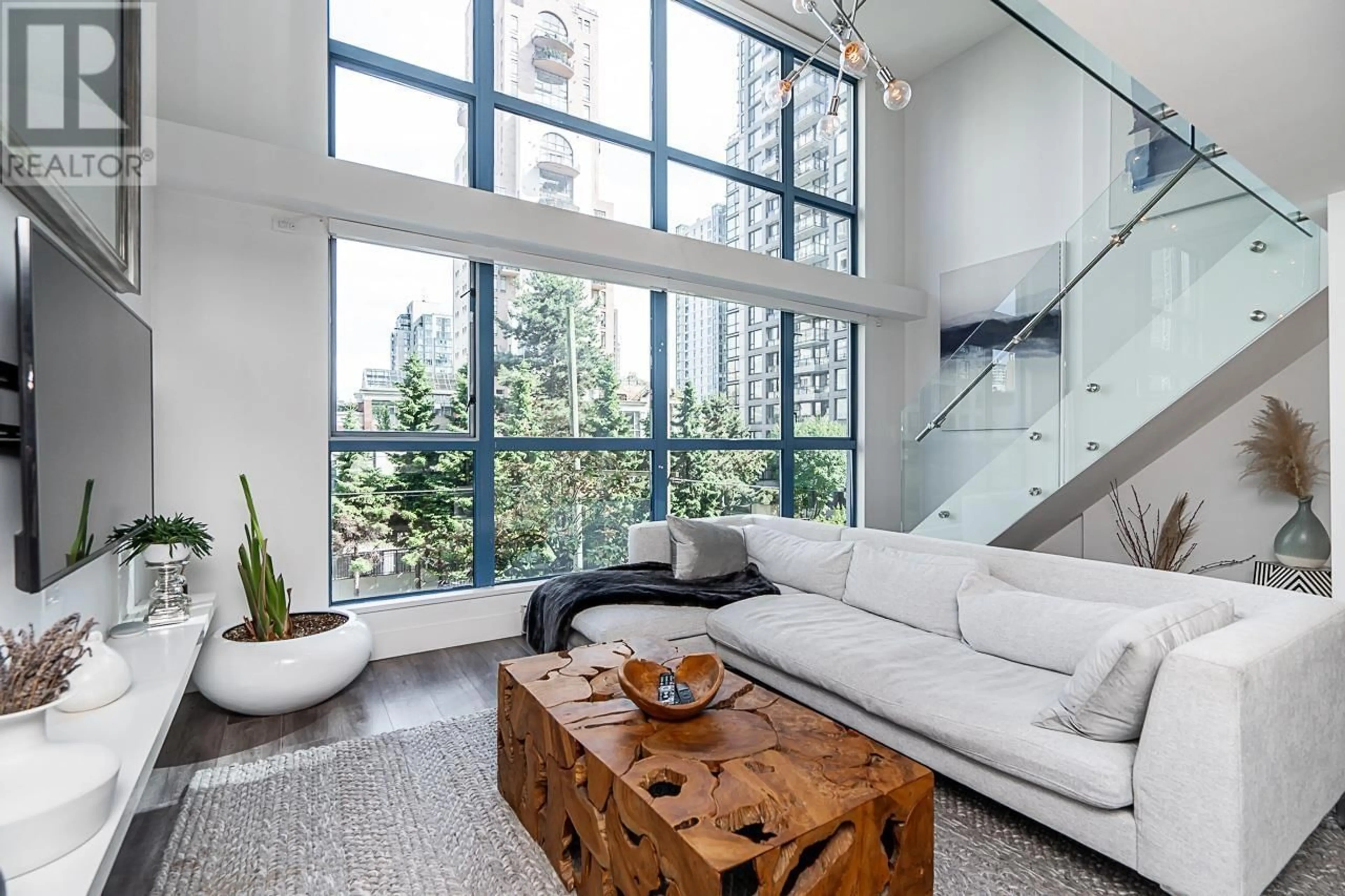 Living room with furniture, cement floor for 212 1238 SEYMOUR STREET, Vancouver British Columbia V6B6J3