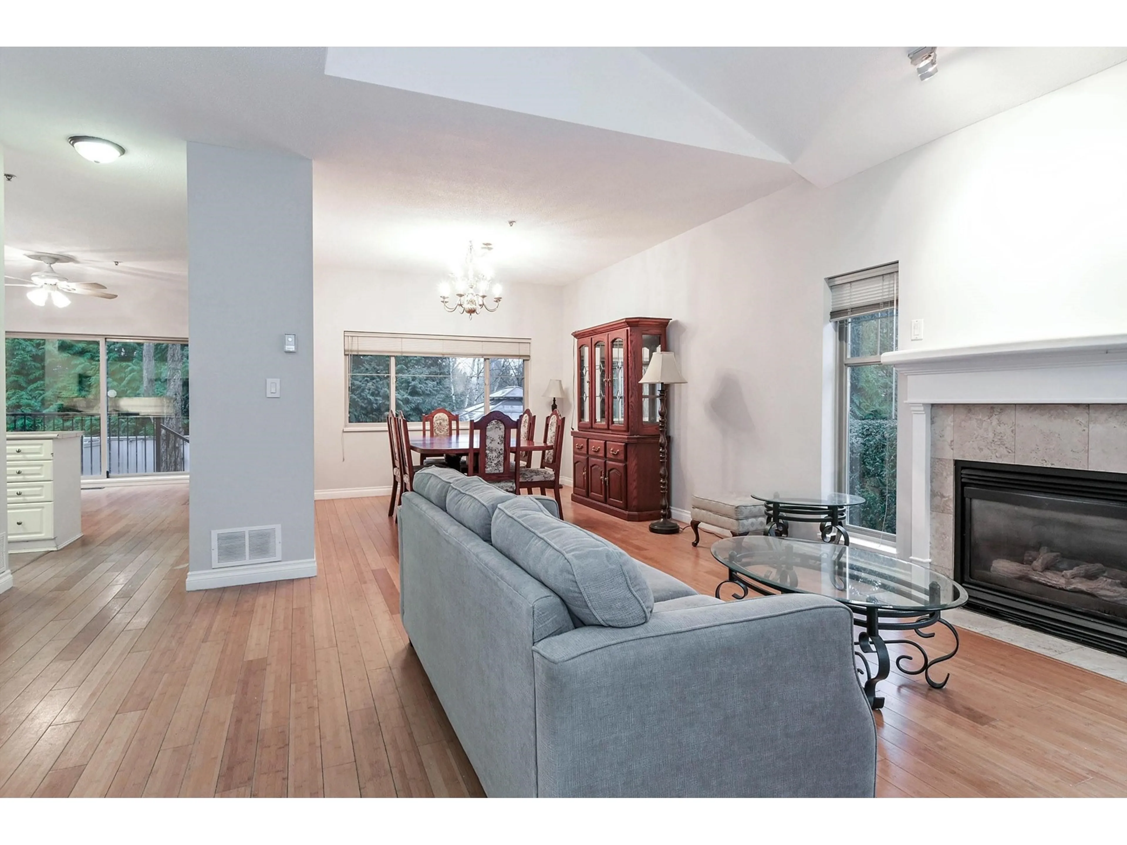 Living room with furniture, wood/laminate floor for 104 - 20820 87, Langley British Columbia V1M3W5