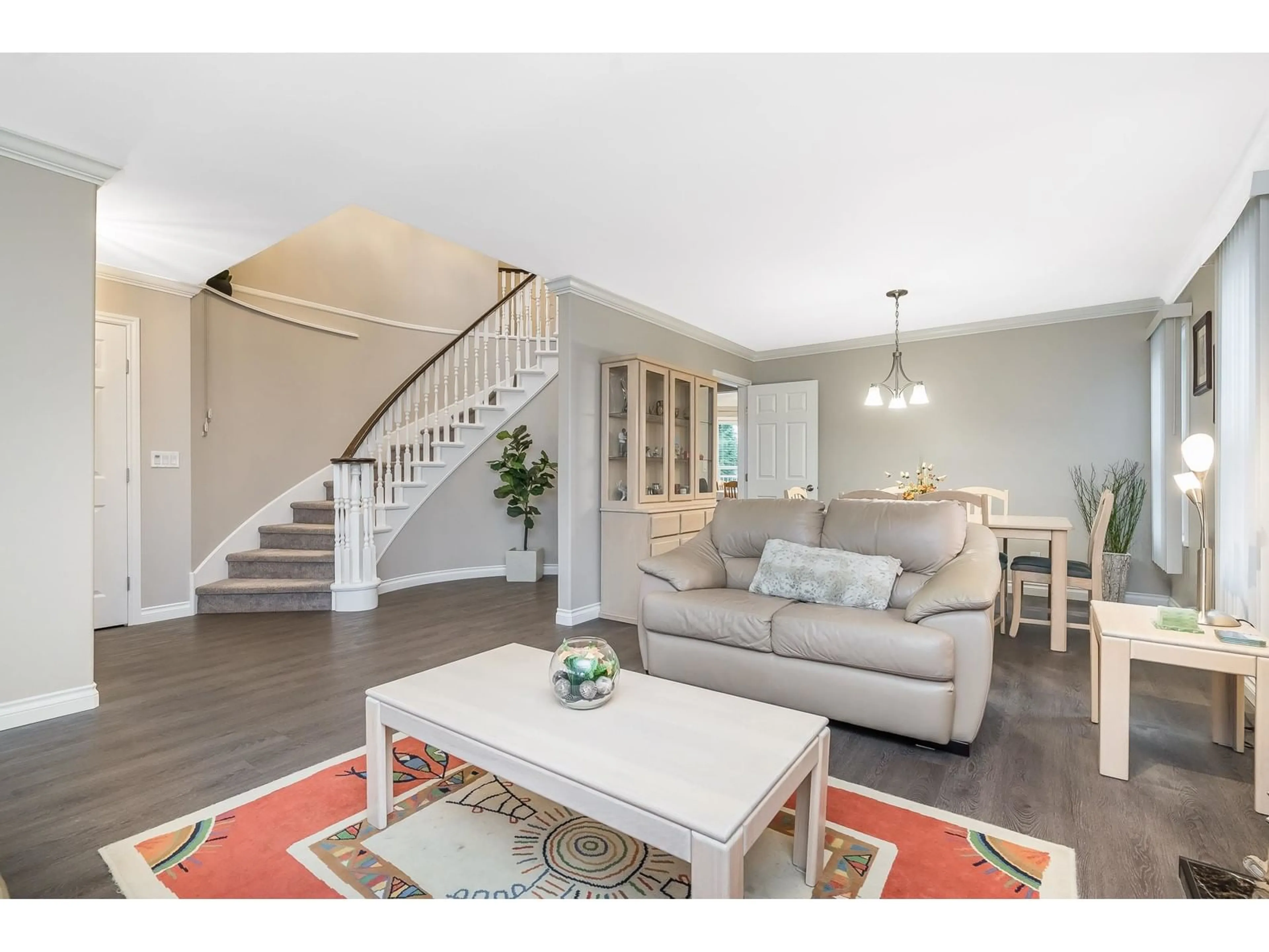 Living room with furniture, wood/laminate floor for 21303 87B AVENUE, Langley British Columbia V1M2A1