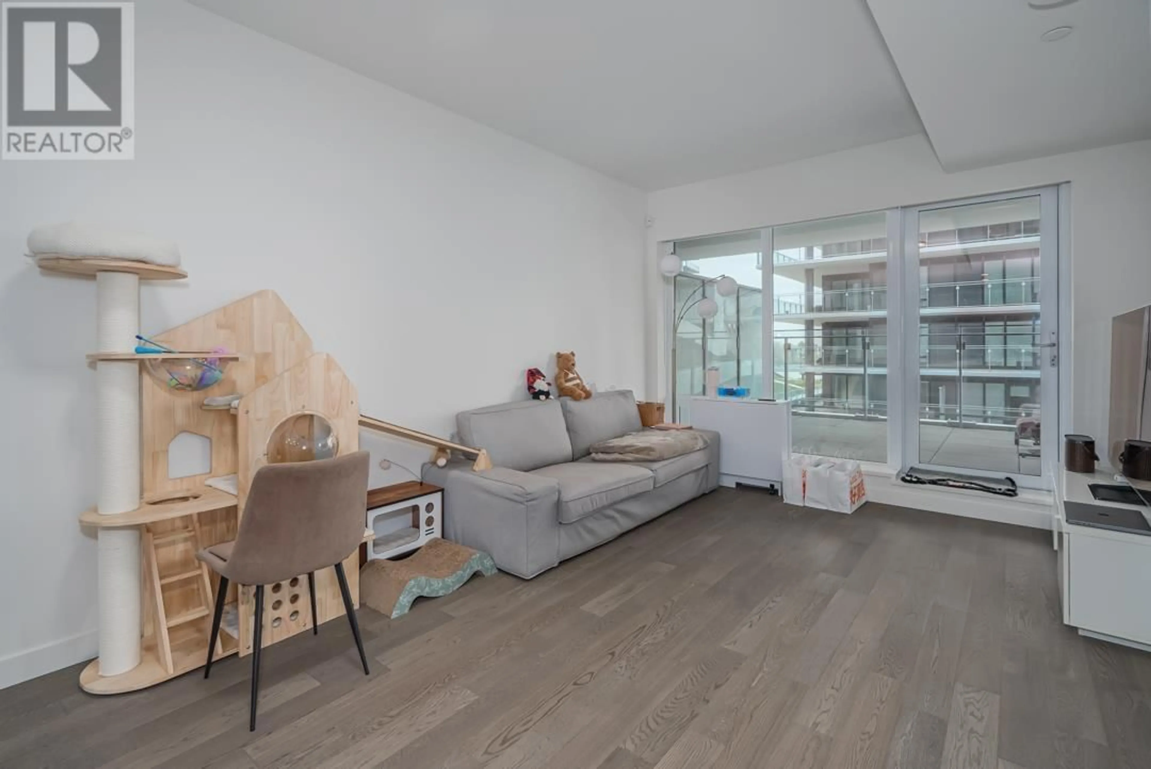 Living room with furniture, unknown for 306 - 6855 PEARSON WAY, Richmond British Columbia V7C0E9