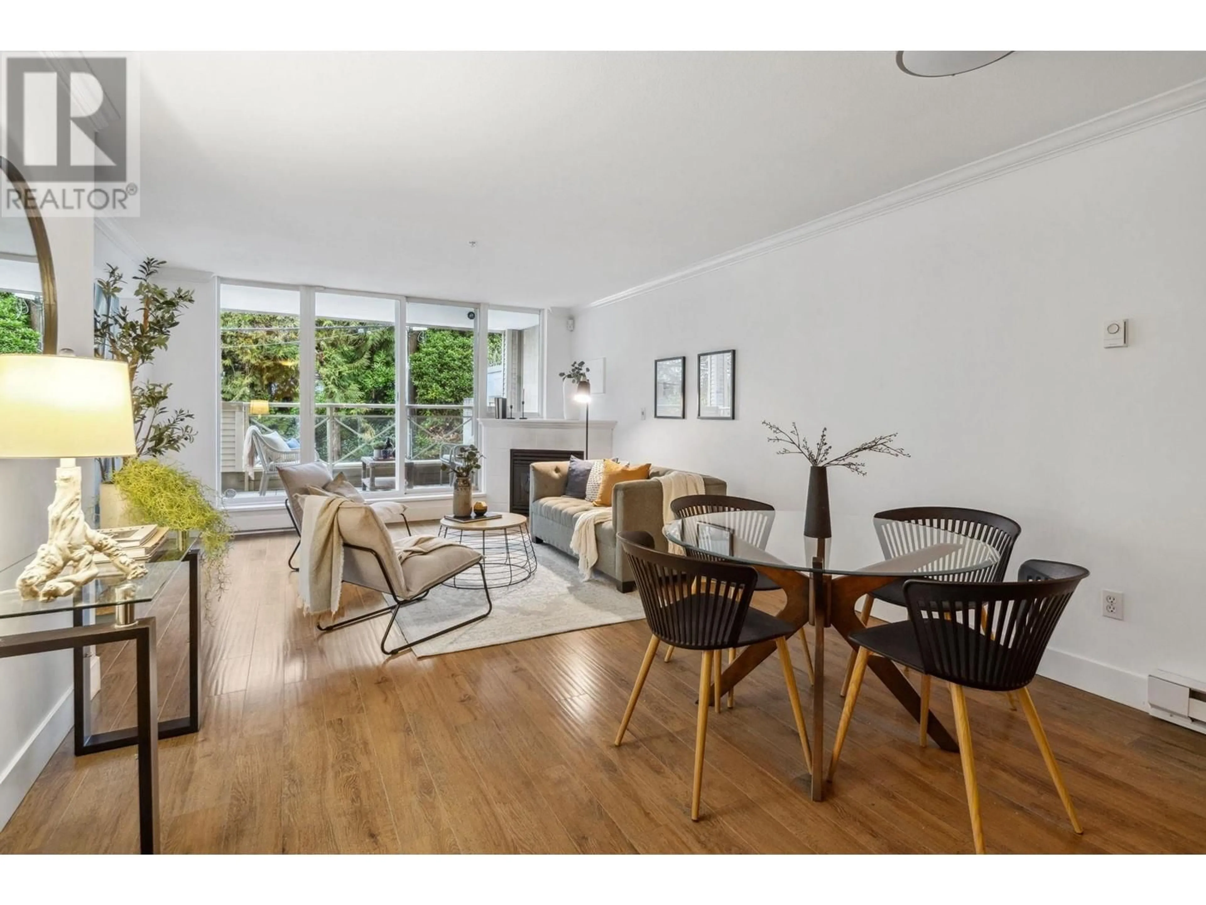 Living room with furniture, wood/laminate floor for 210 5629 DUNBAR STREET, Vancouver British Columbia V6N1W5