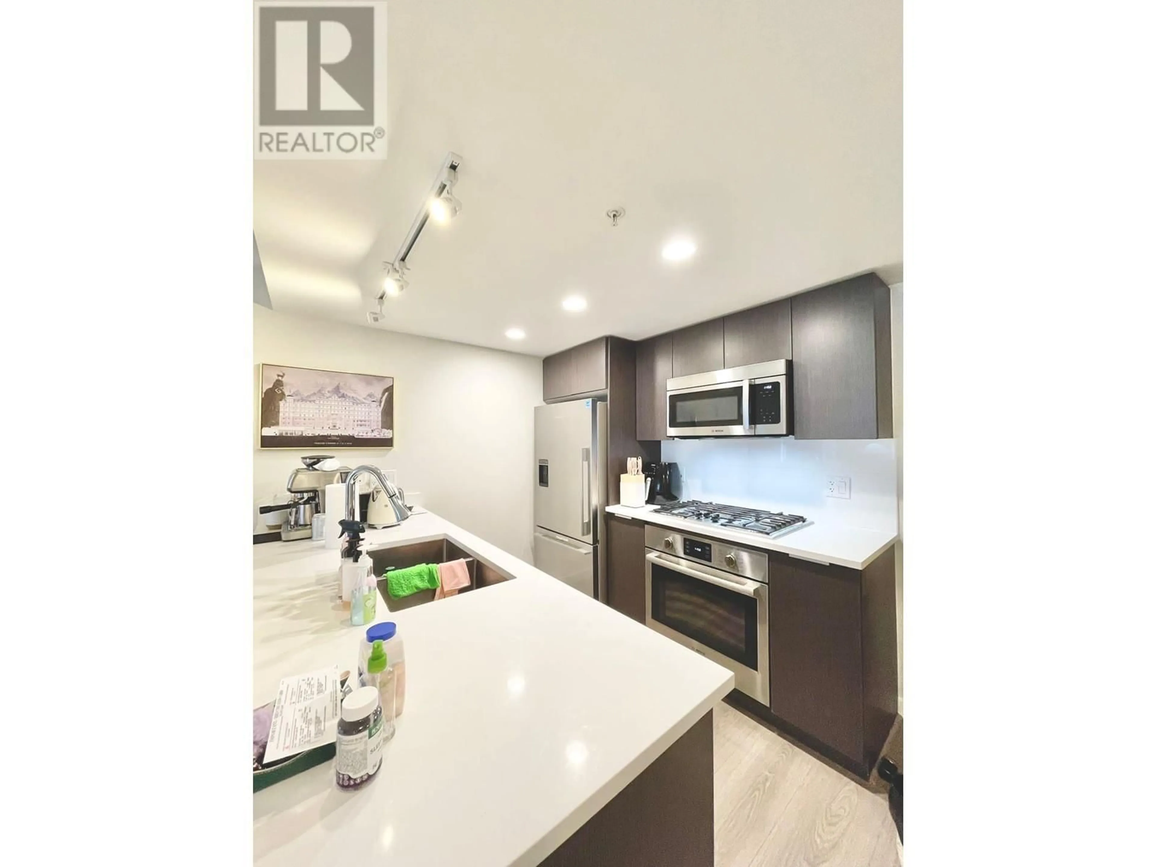 Open concept kitchen, unknown for 705 - 8699 HAZELBRIDGE WAY, Richmond British Columbia V6X0T4