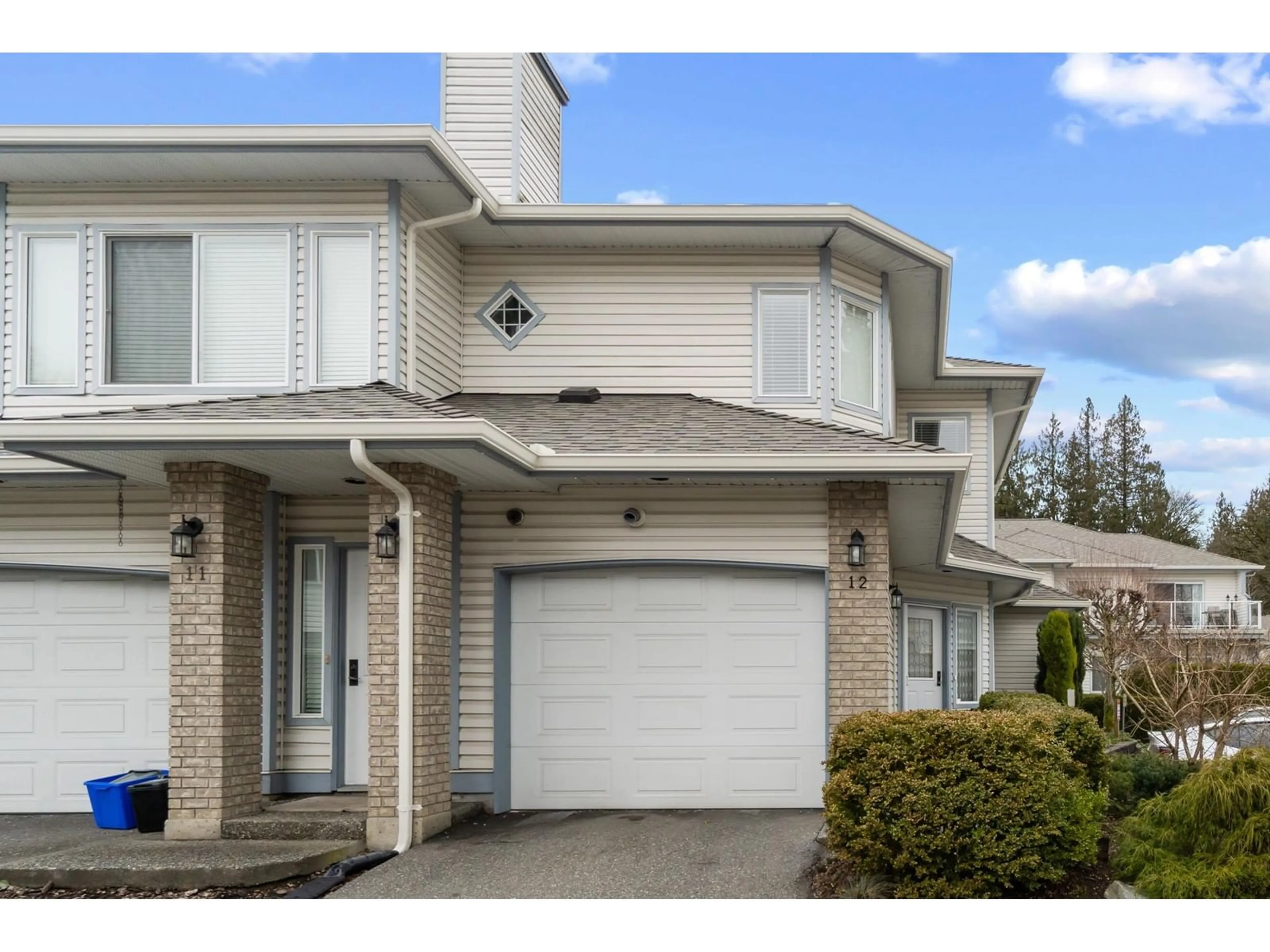 Home with vinyl exterior material, street for 12 21579 88B AVENUE, Langley British Columbia V1M2X4