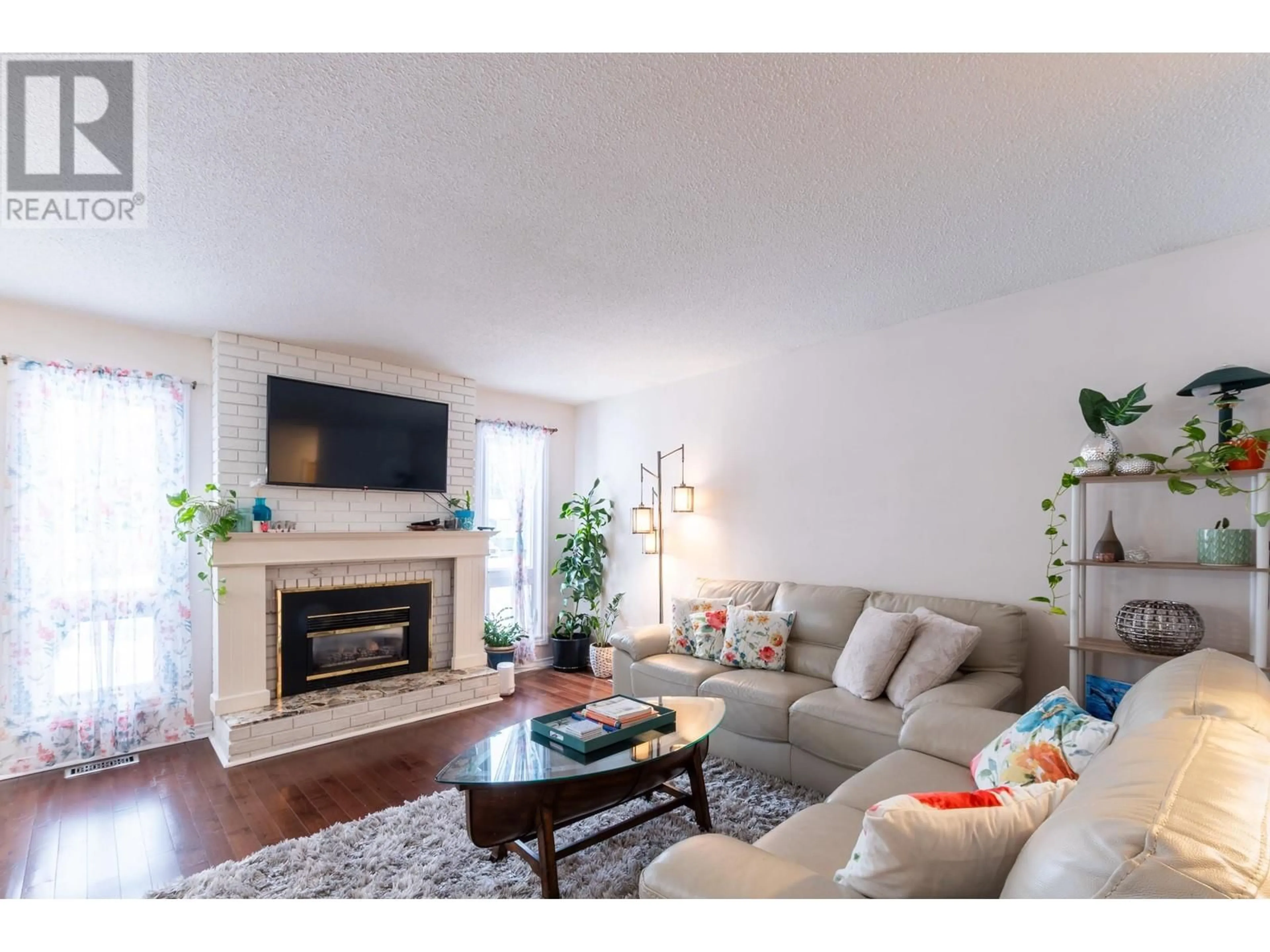 Living room with furniture, wood/laminate floor for 8125 ROCHESTER CRESCENT, Prince George British Columbia V2N3W9