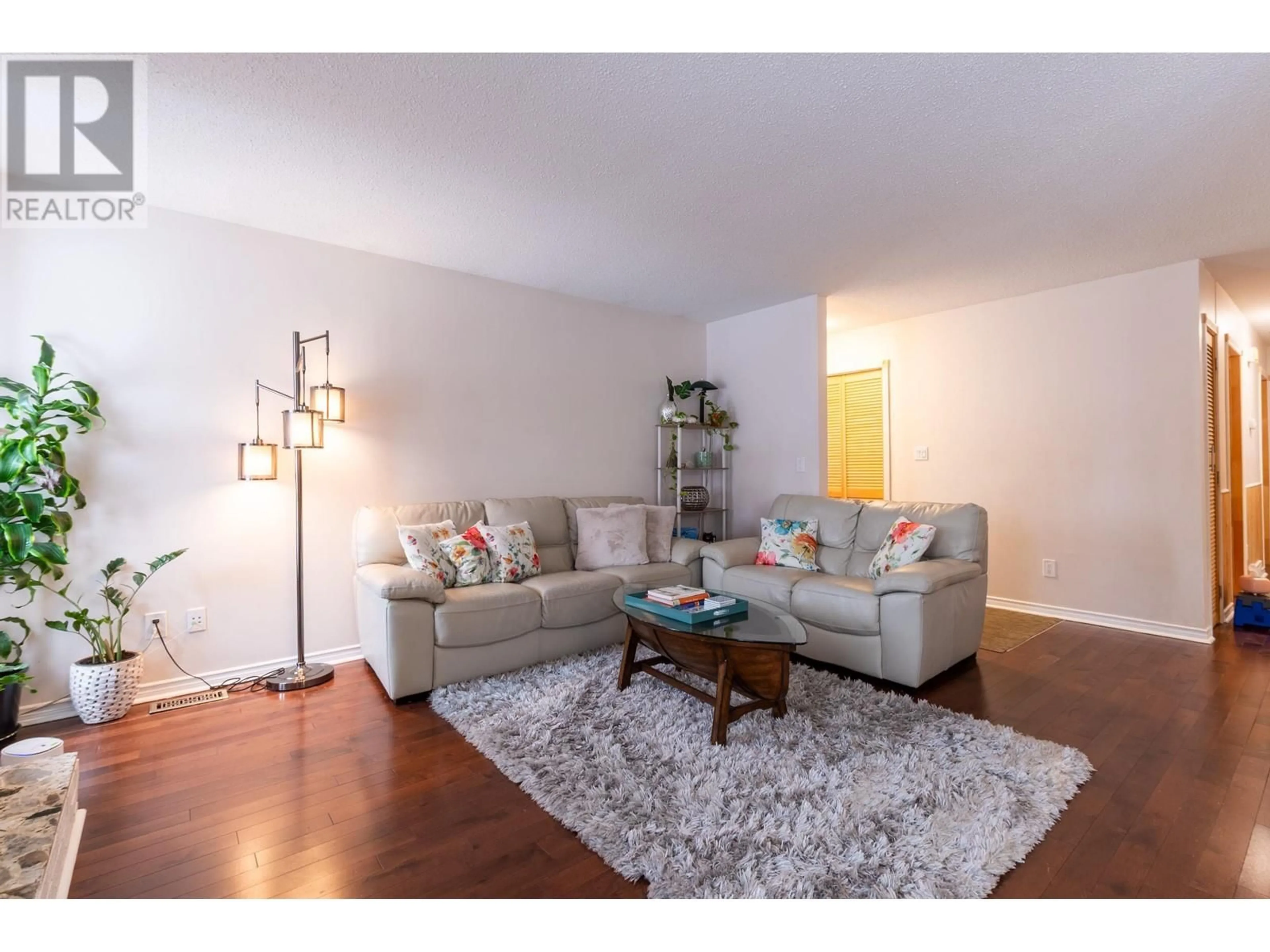 Living room with furniture, wood/laminate floor for 8125 ROCHESTER CRESCENT, Prince George British Columbia V2N3W9