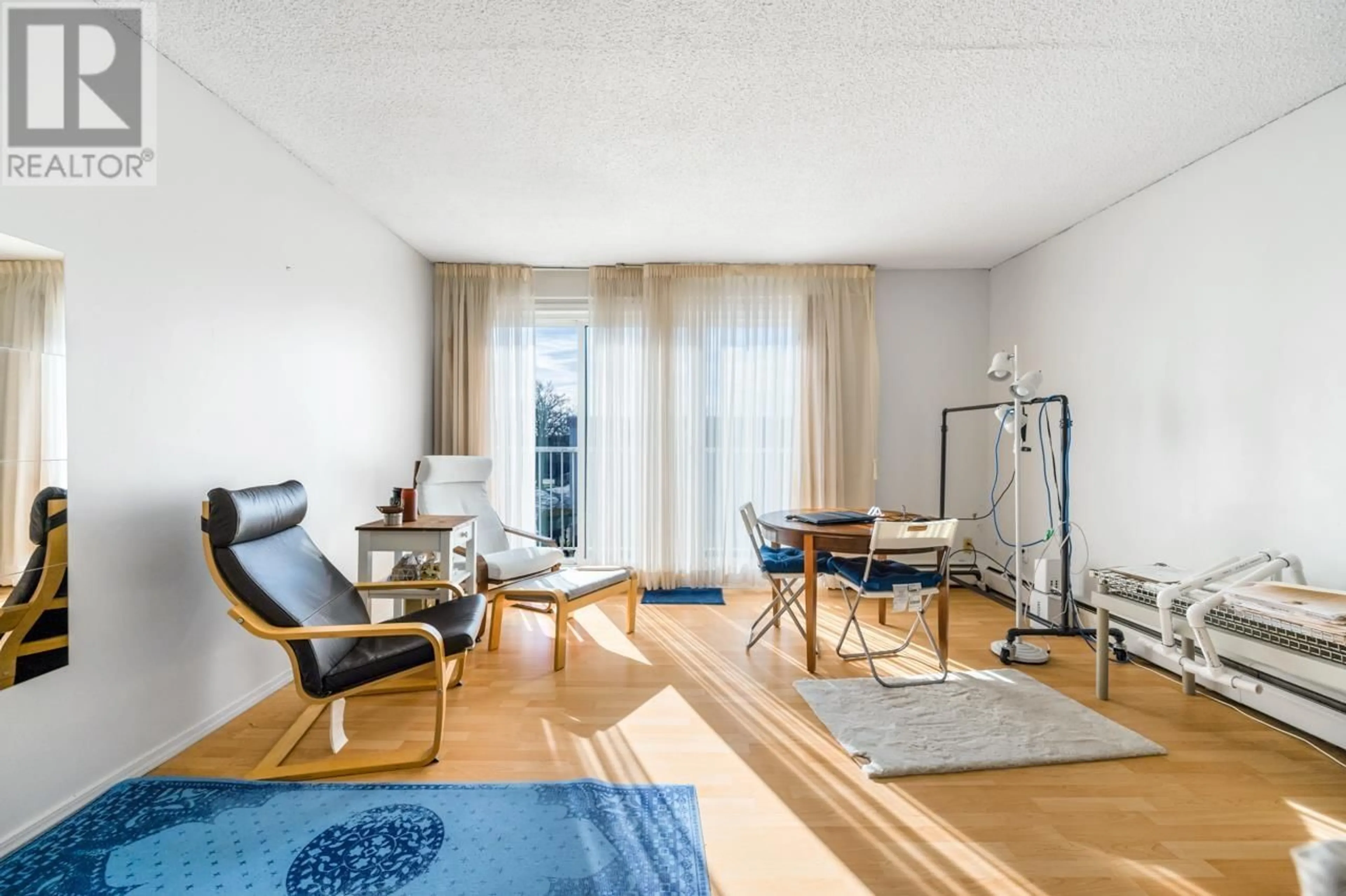 Living room with furniture, wood/laminate floor for 302 7180 LINDSAY ROAD, Richmond British Columbia V7C3M6