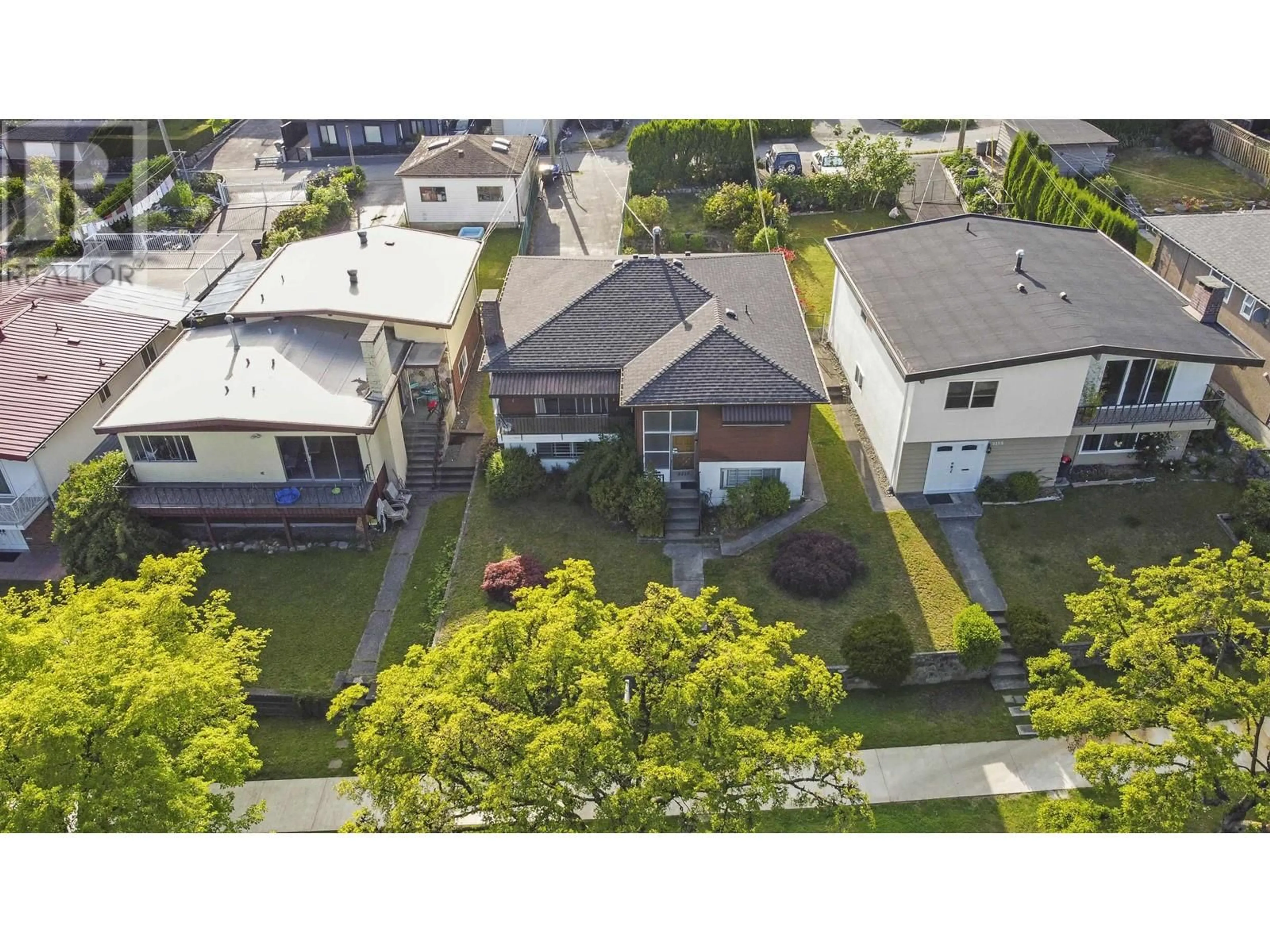 A pic from outside/outdoor area/front of a property/back of a property/a pic from drone, street for 8215 ELLIOTT STREET, Vancouver British Columbia V5S2P3