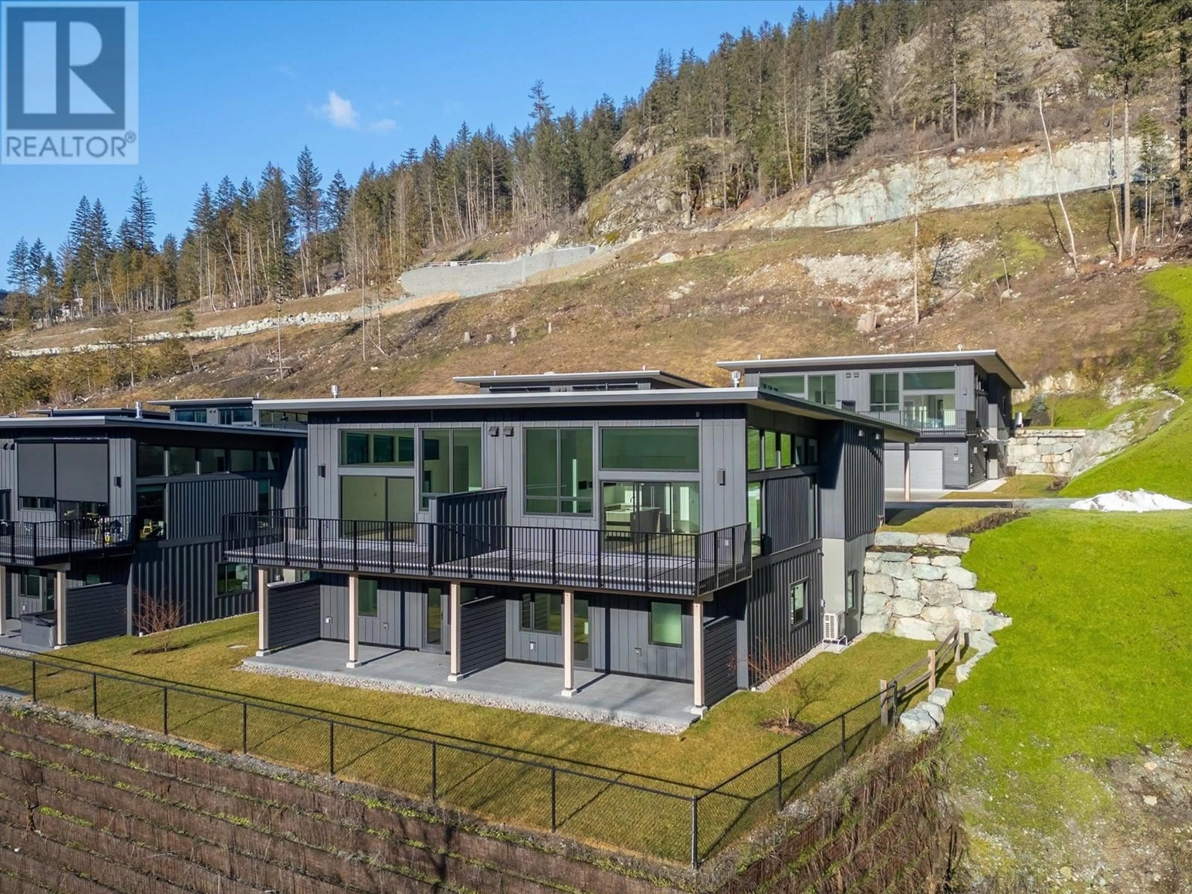 A pic from outside/outdoor area/front of a property/back of a property/a pic from drone, unknown for 26 4000 SUNSTONE WAY, Pemberton British Columbia V0N2L3