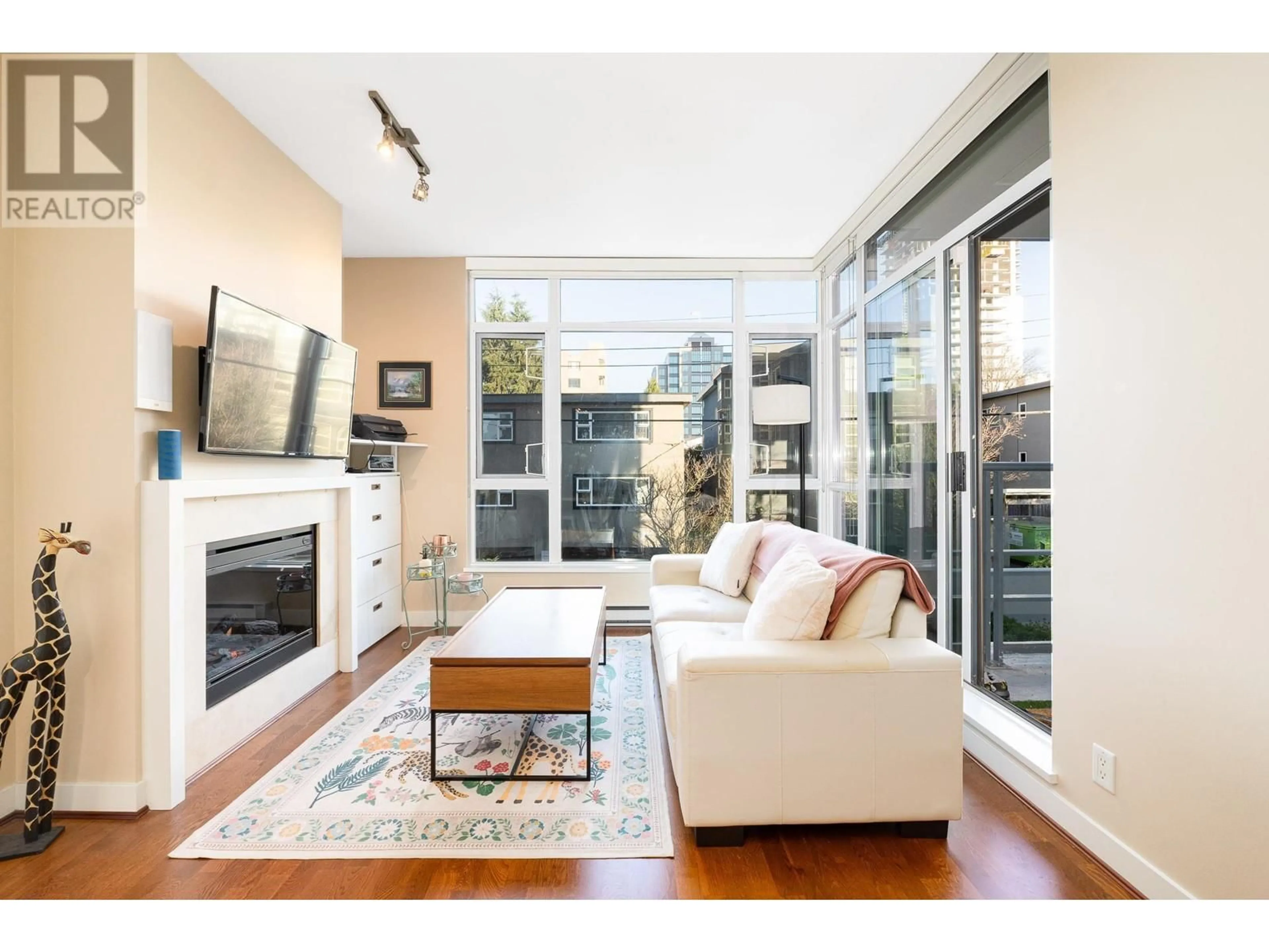 Living room with furniture, wood/laminate floor for 203 1333 W 11TH AVENUE, Vancouver British Columbia V6H0A4