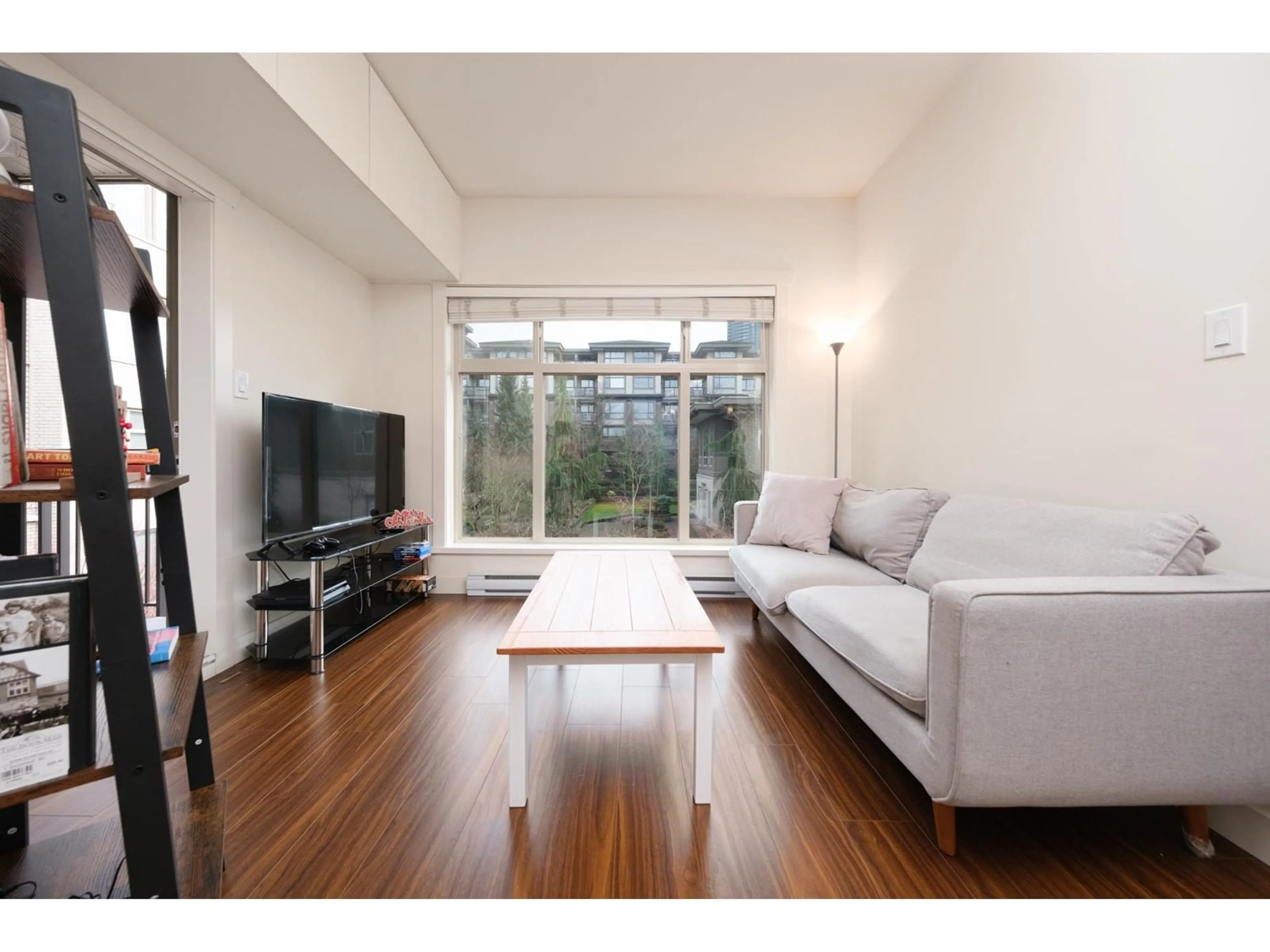 Living room with furniture, wood/laminate floor for 211 13468 KING GEORGE BOULEVARD, Surrey British Columbia V3T0H5