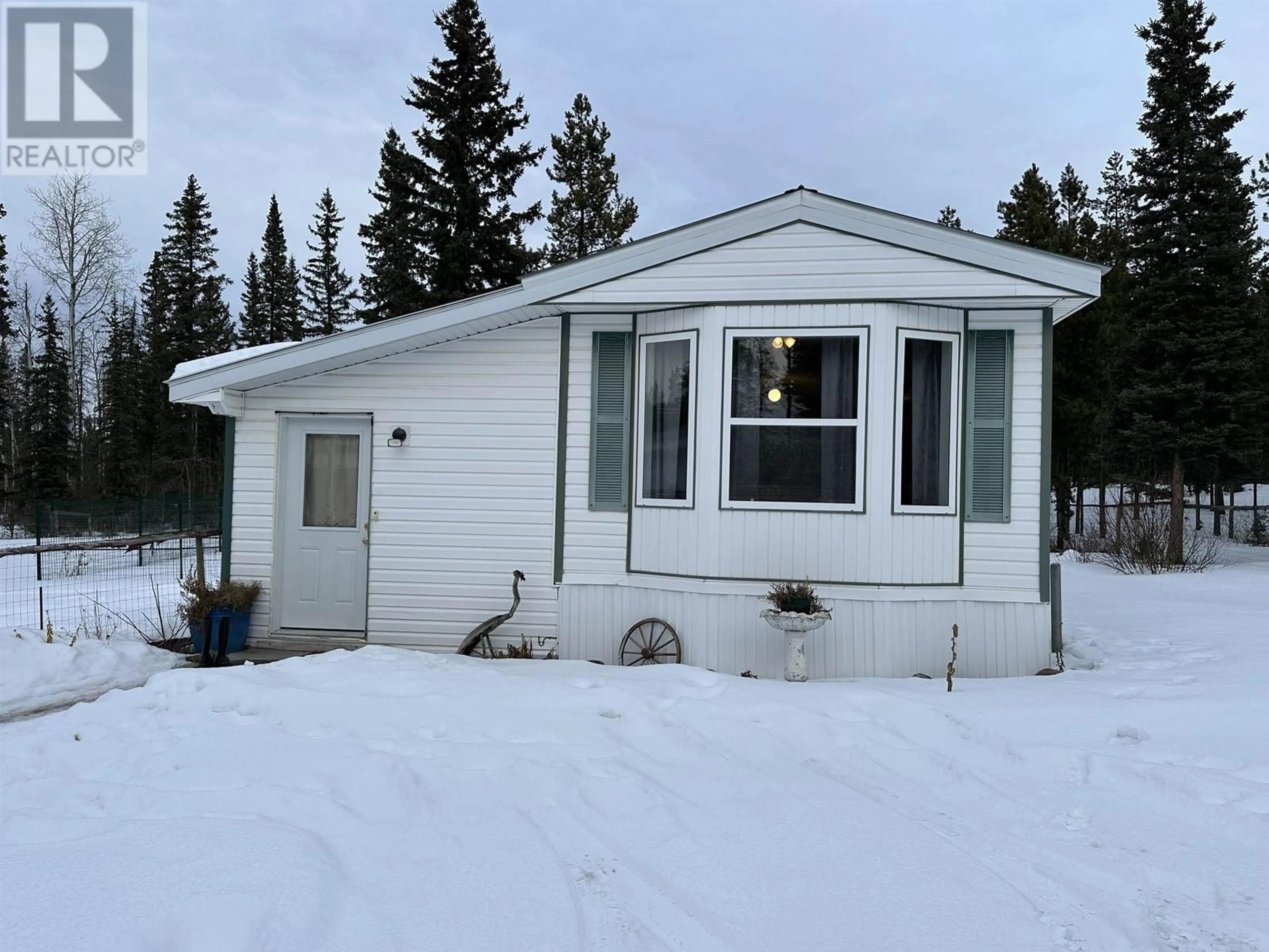 Home with vinyl exterior material, street for 5793 LITTLE FORT 24 HIGHWAY, 100 Mile House British Columbia V0K2E2