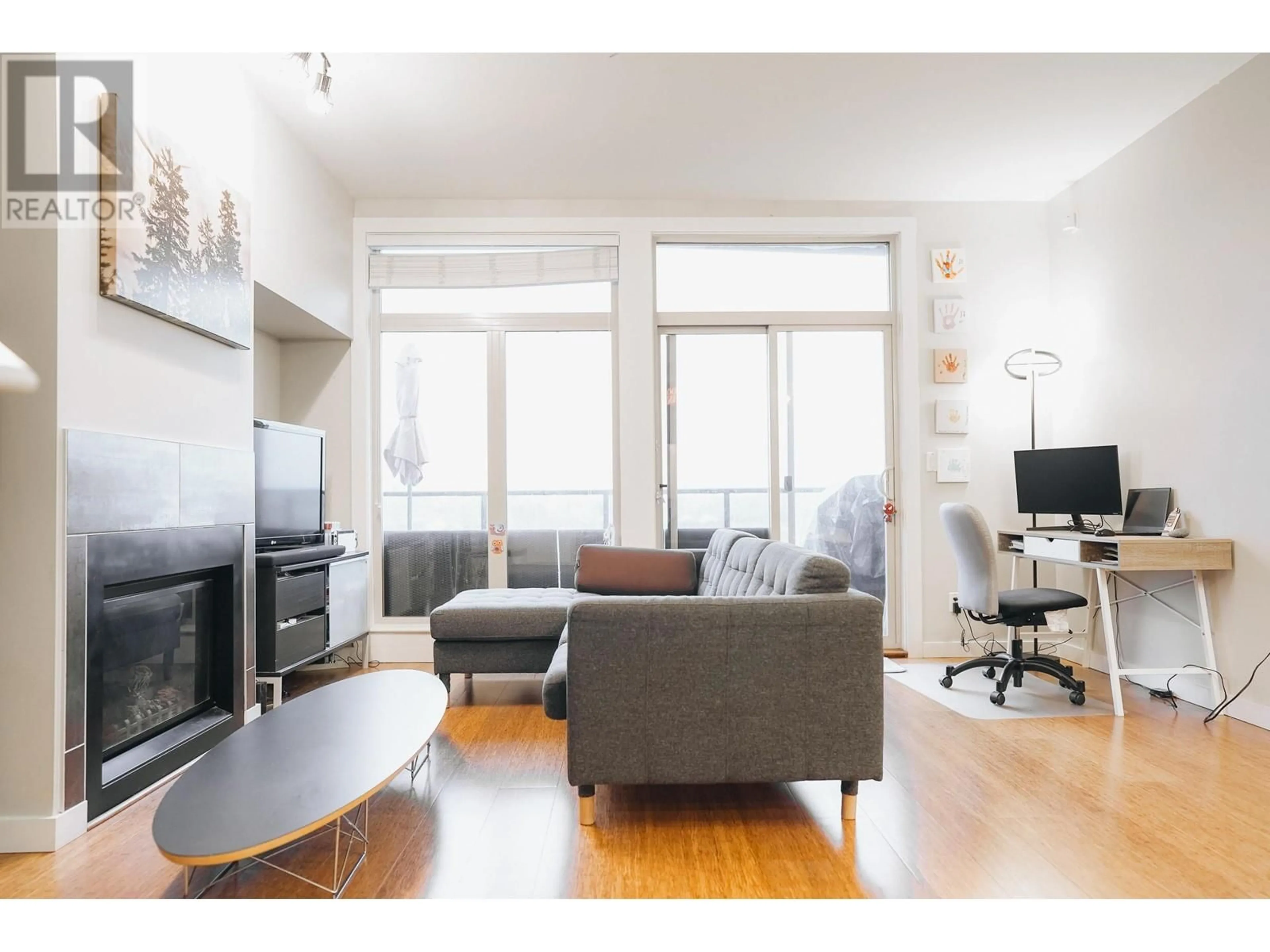 Living room with furniture, wood/laminate floor for 410 6233 LONDON ROAD, Richmond British Columbia V7E3S3