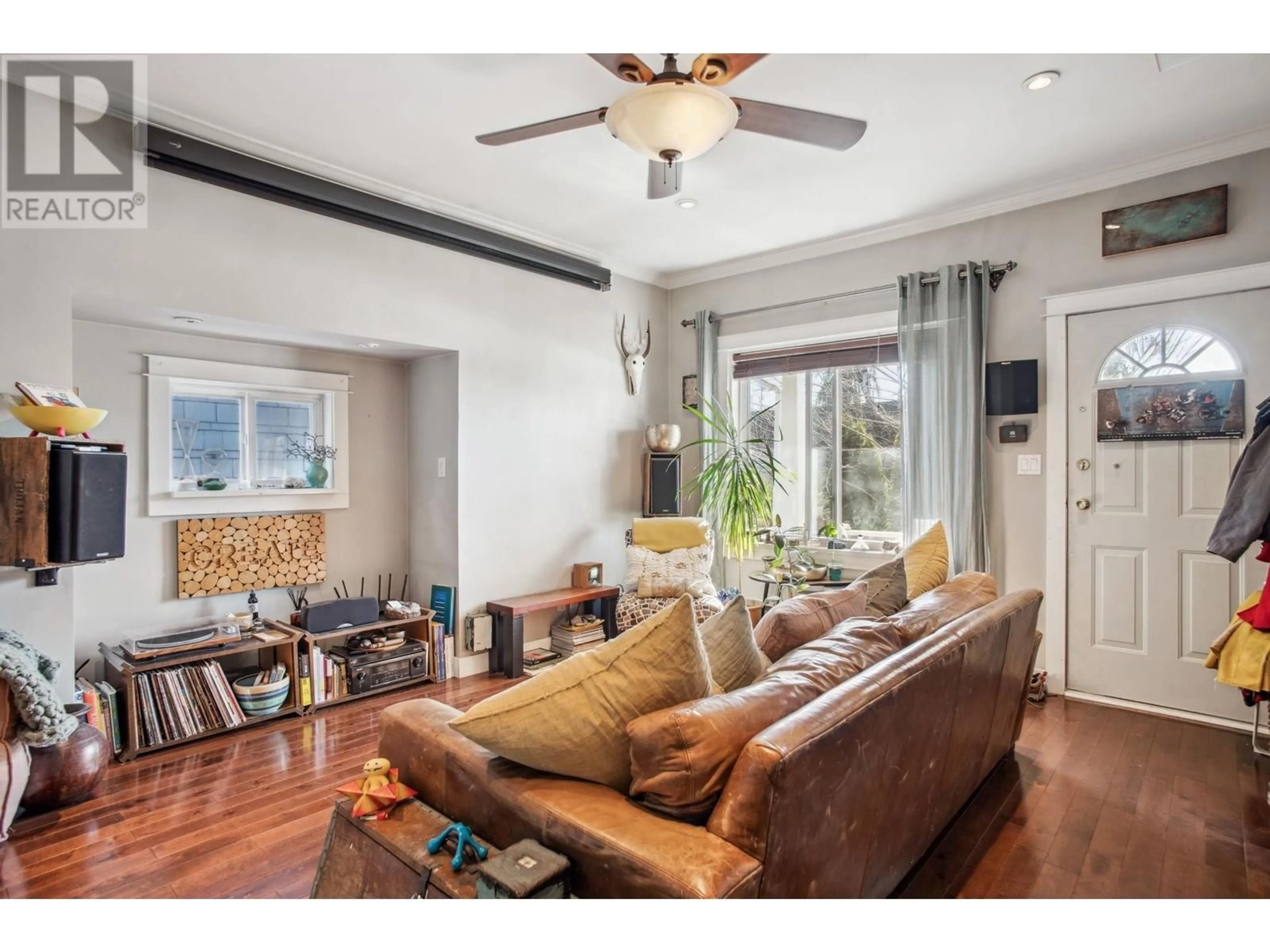 Living room with furniture, wood/laminate floor for 3617 ADANAC STREET, Vancouver British Columbia V5K2P7