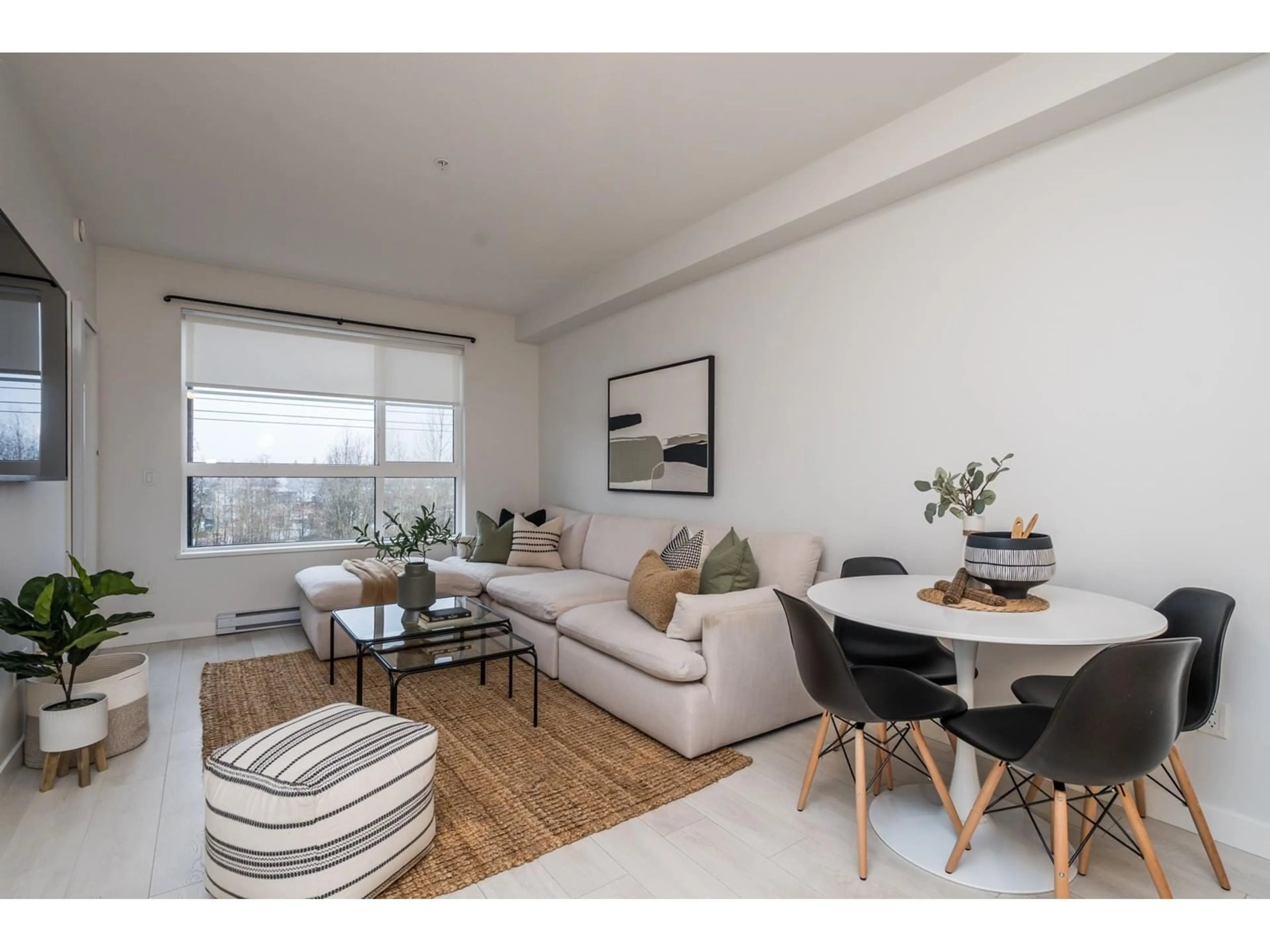 Living room with furniture, wood/laminate floor for 402 20829 77A AVENUE, Langley British Columbia V2Y0Y5