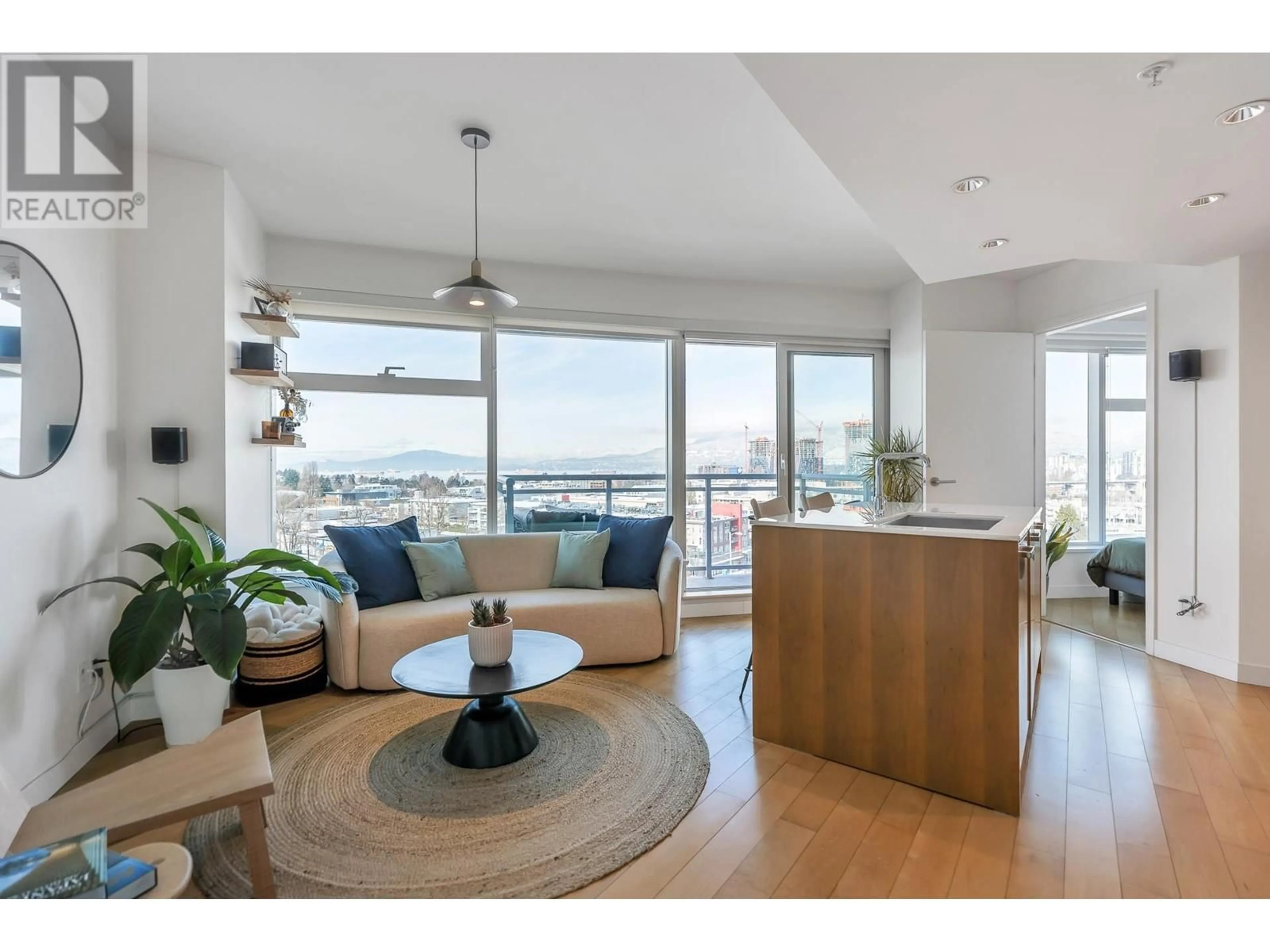 Living room with furniture, wood/laminate floor for 903 1565 W 6TH AVENUE, Vancouver British Columbia V6J1R1