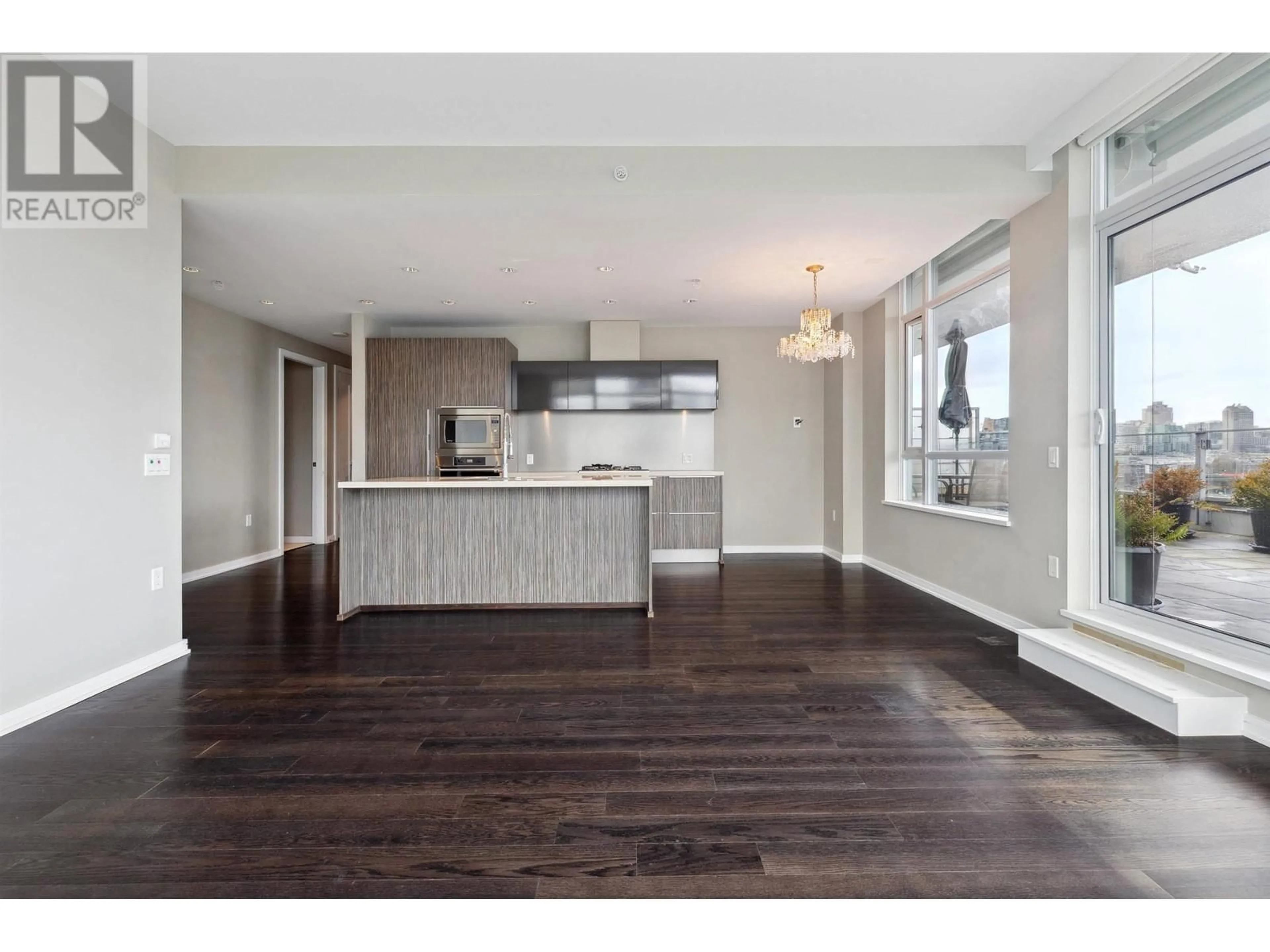 Open concept kitchen, wood/laminate floor for 906 1616 COLUMBIA STREET, Vancouver British Columbia V5Y0B7