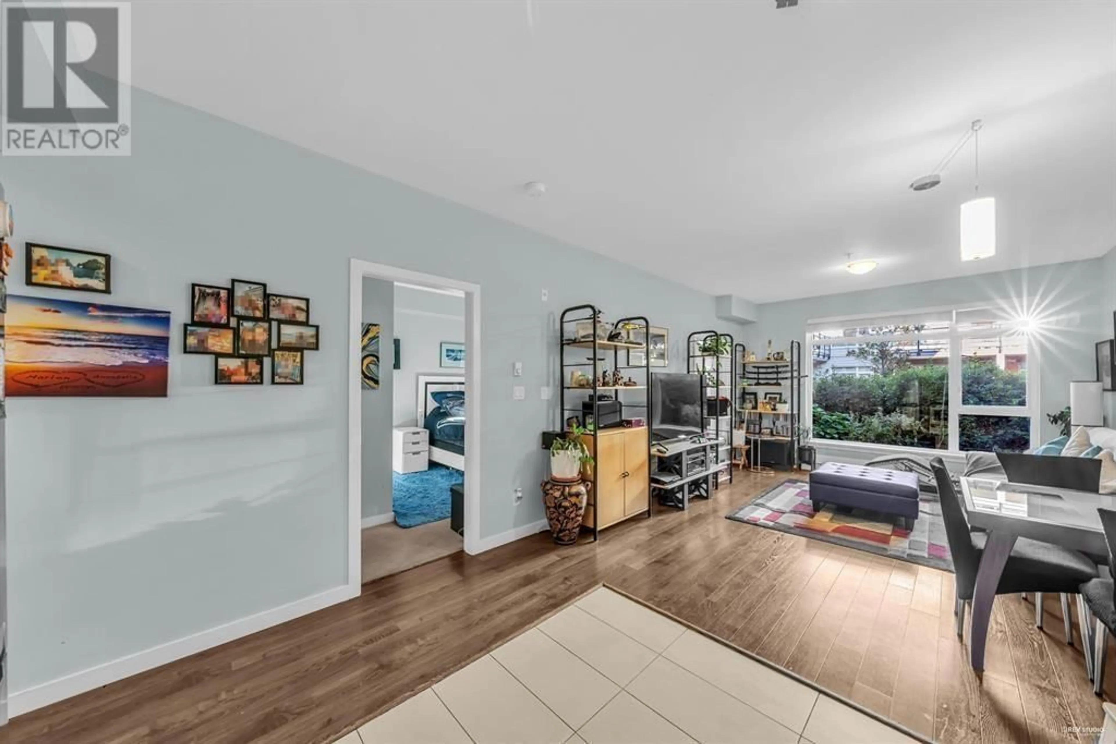 Living room with furniture, wood/laminate floor for 201 - 5248 GRIMMER STREET, Burnaby British Columbia V5H0E1