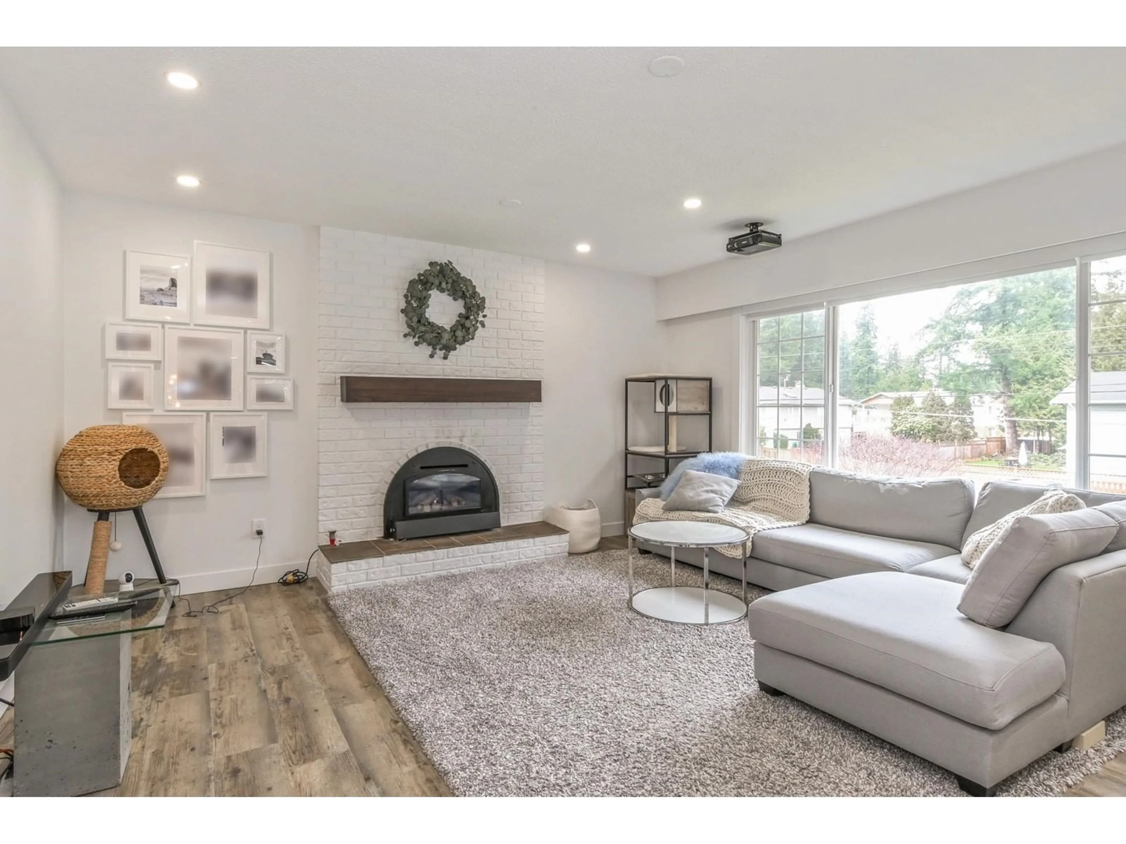 Living room with furniture, wood/laminate floor for 20334 38A, Langley British Columbia V3A5M3
