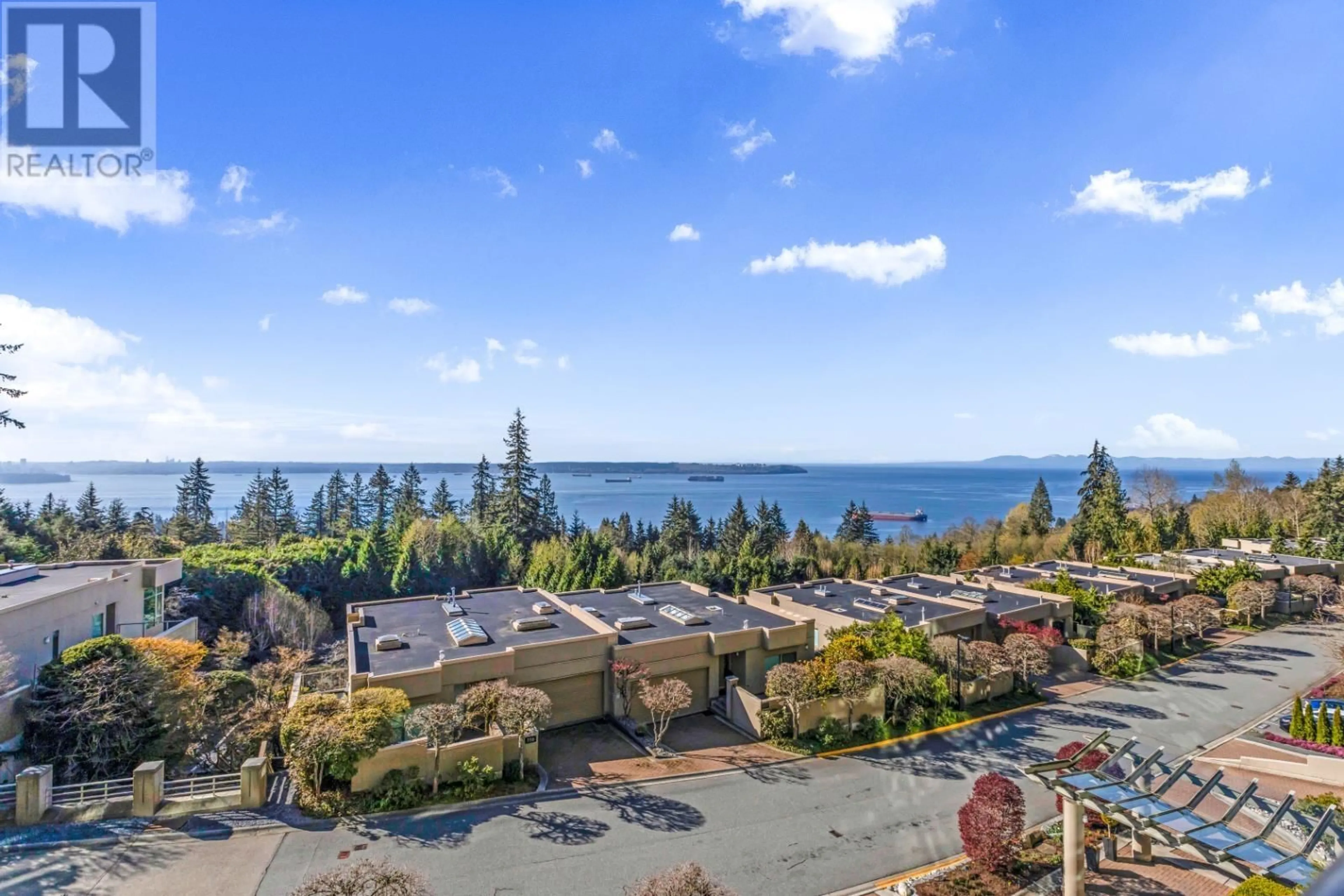 A pic from outside/outdoor area/front of a property/back of a property/a pic from drone, water/lake/river/ocean view for 403 3131 DEER RIDGE DRIVE, West Vancouver British Columbia V7S4W1