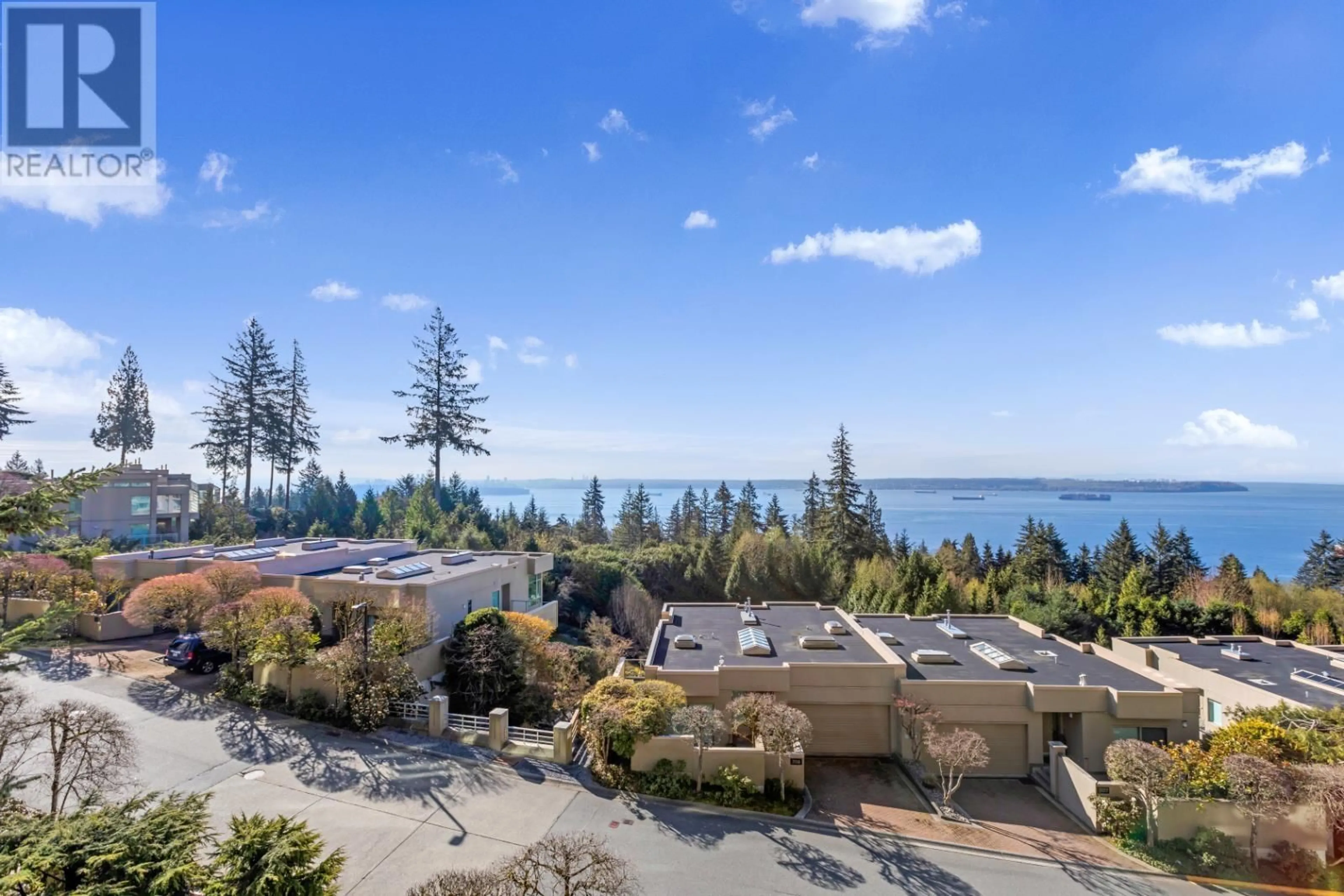 A pic from outside/outdoor area/front of a property/back of a property/a pic from drone, water/lake/river/ocean view for 403 3131 DEER RIDGE DRIVE, West Vancouver British Columbia V7S4W1