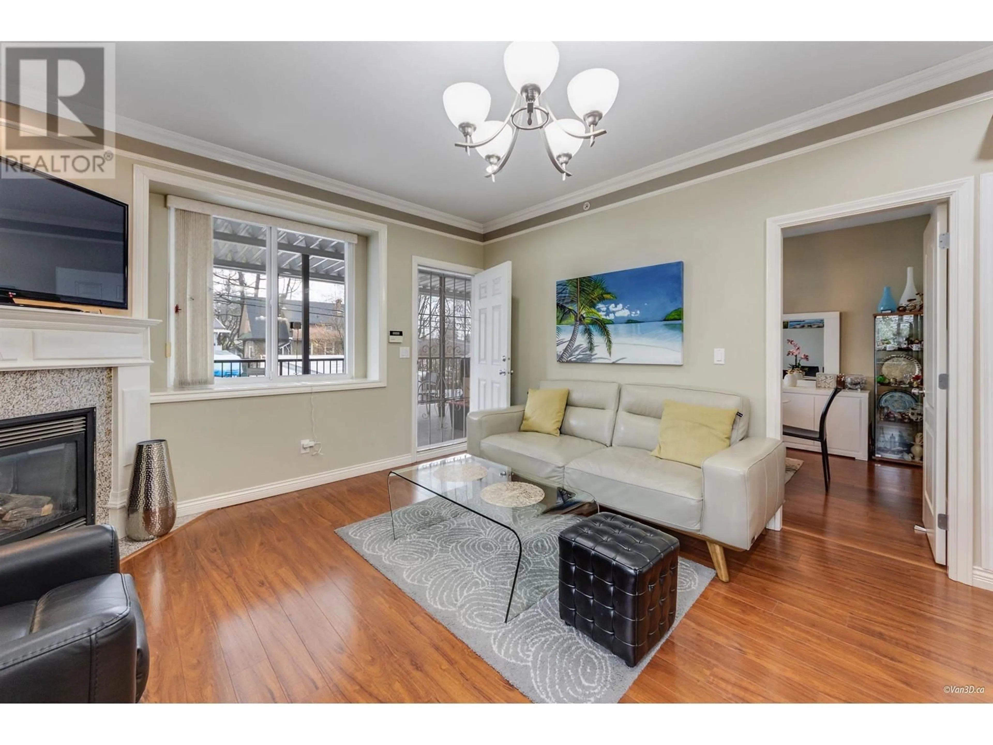 Living room with furniture, wood/laminate floor for 2048 E 1ST AVENUE, Vancouver British Columbia V5N1B5