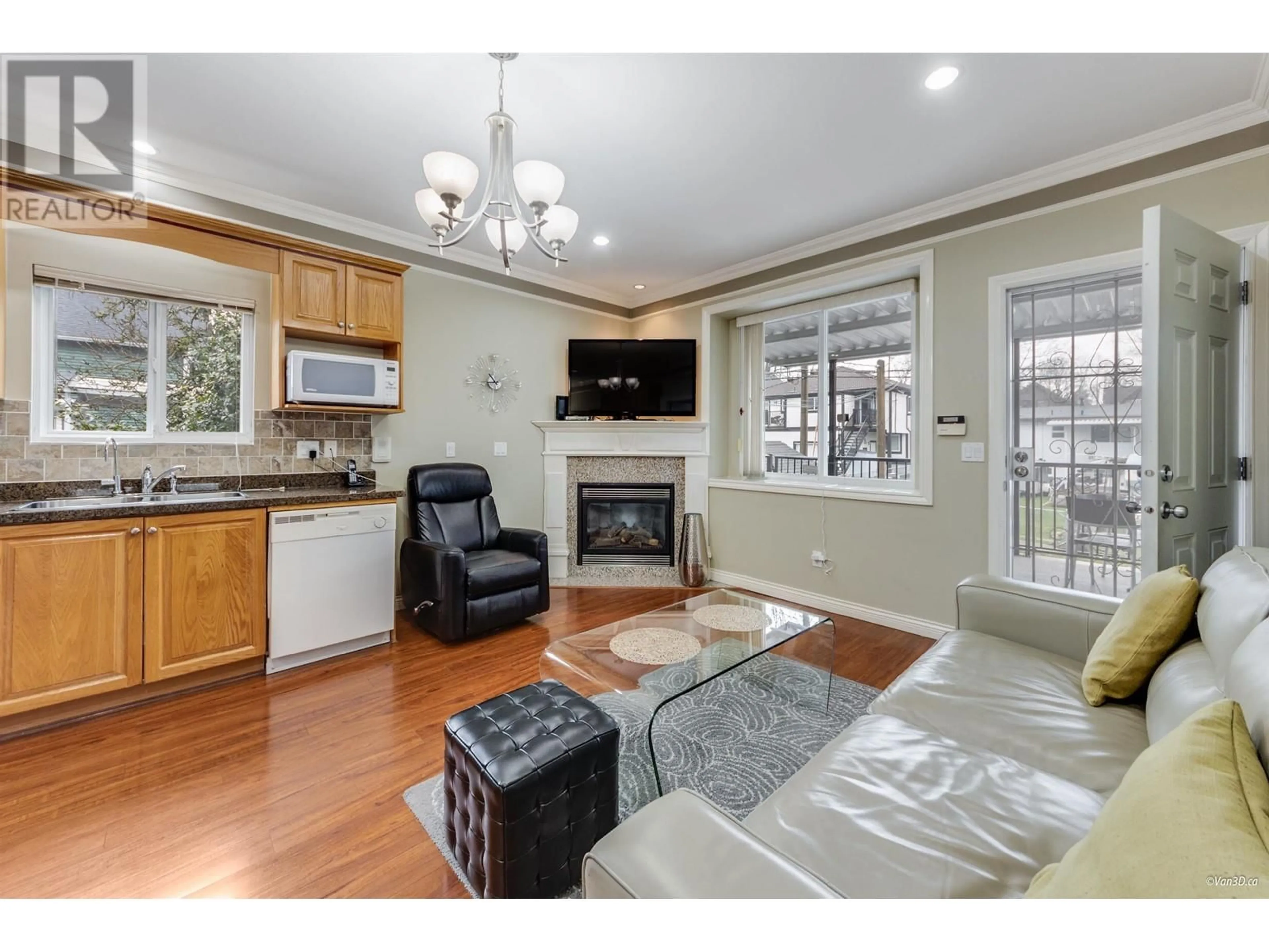 Living room with furniture, wood/laminate floor for 2048 E 1ST AVENUE, Vancouver British Columbia V5N1B5