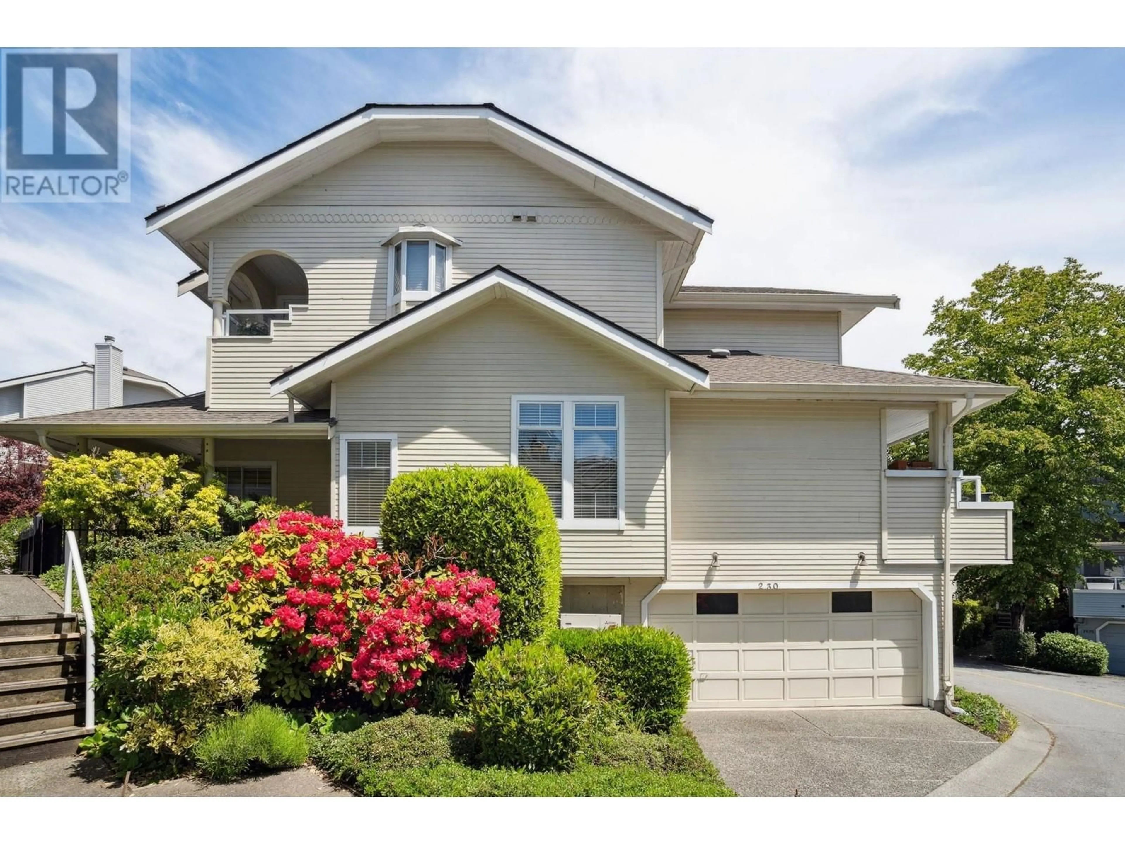 Home with vinyl exterior material, street for 230 WATERLEIGH DRIVE, Vancouver British Columbia V5X4T2