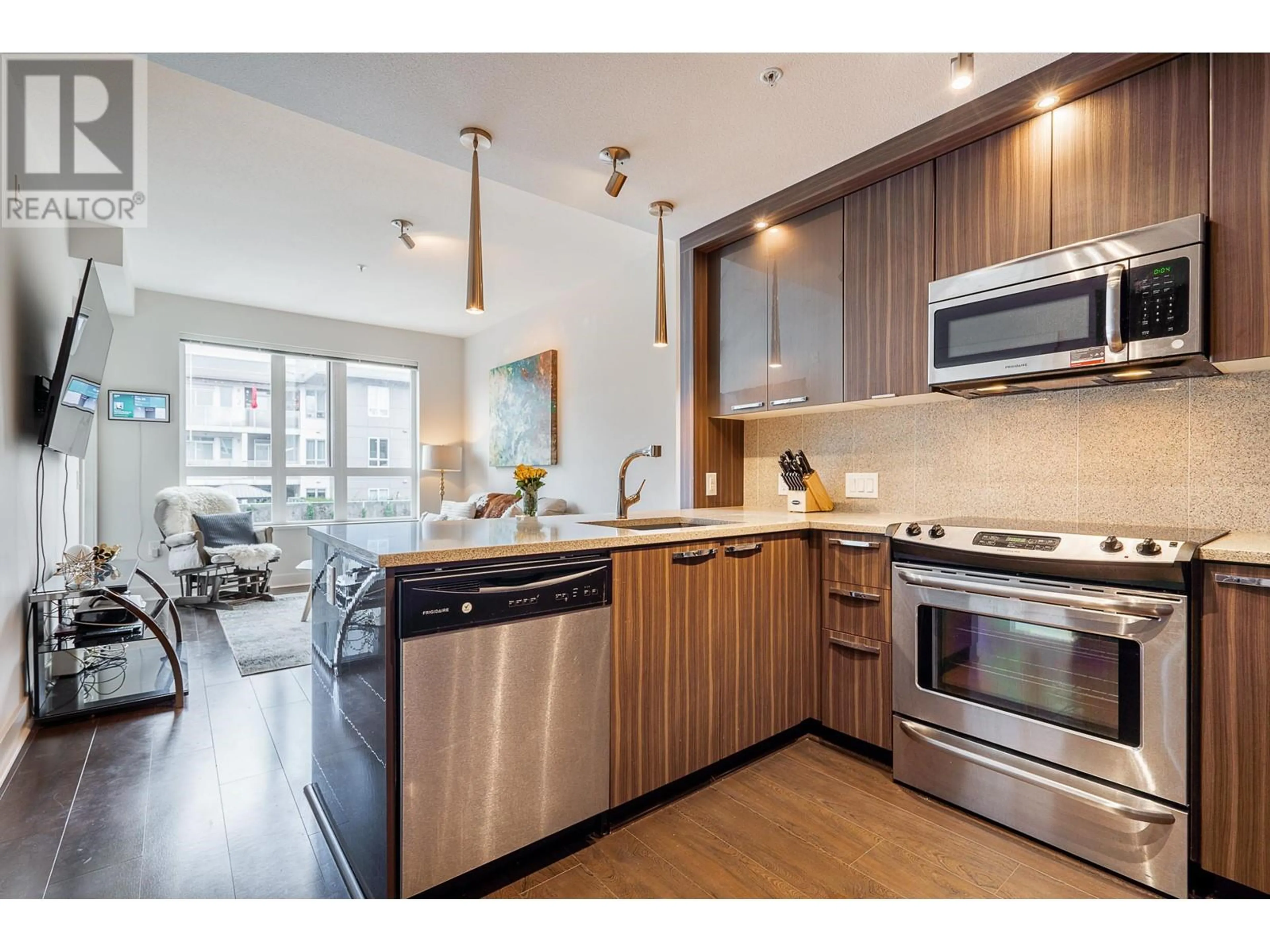 Open concept kitchen, wood/laminate floor for 306 733 W 14TH STREET, North Vancouver British Columbia V7M0C6