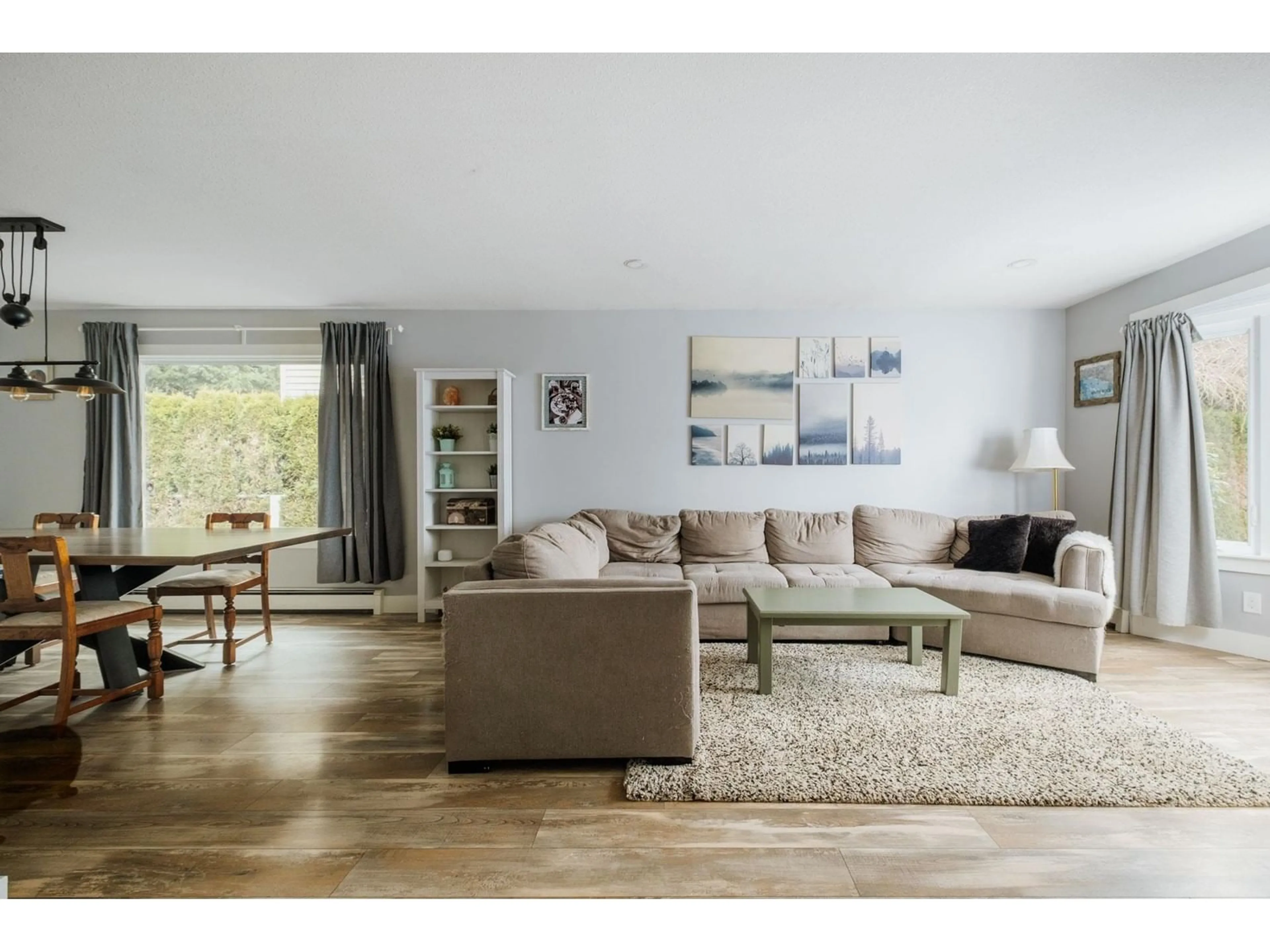 Living room with furniture, wood/laminate floor for 15729 20 AVENUE, Surrey British Columbia V4A2A7