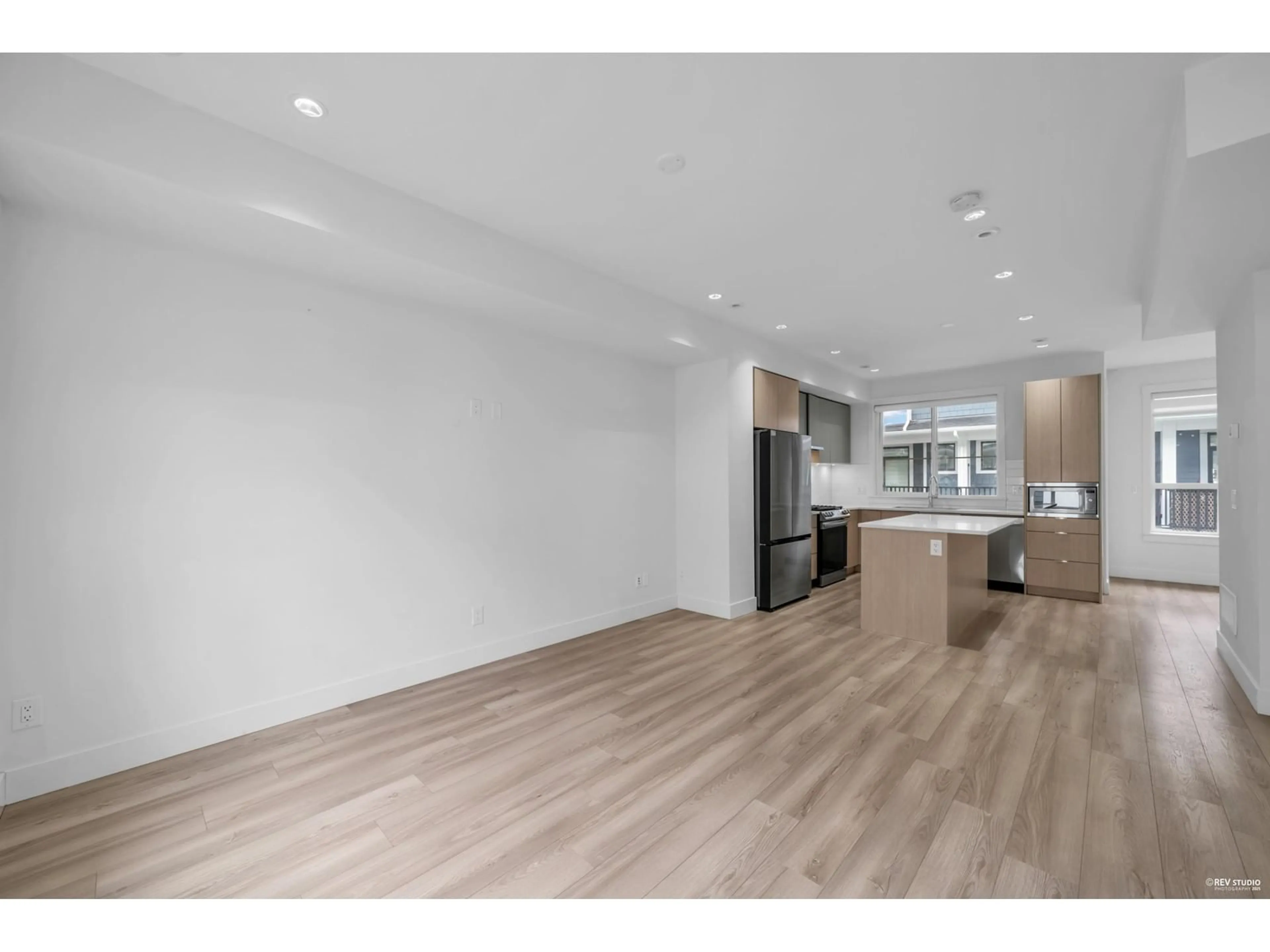Open concept kitchen, wood/laminate floor for 15 - 11556 72A, Delta British Columbia V4C1A9