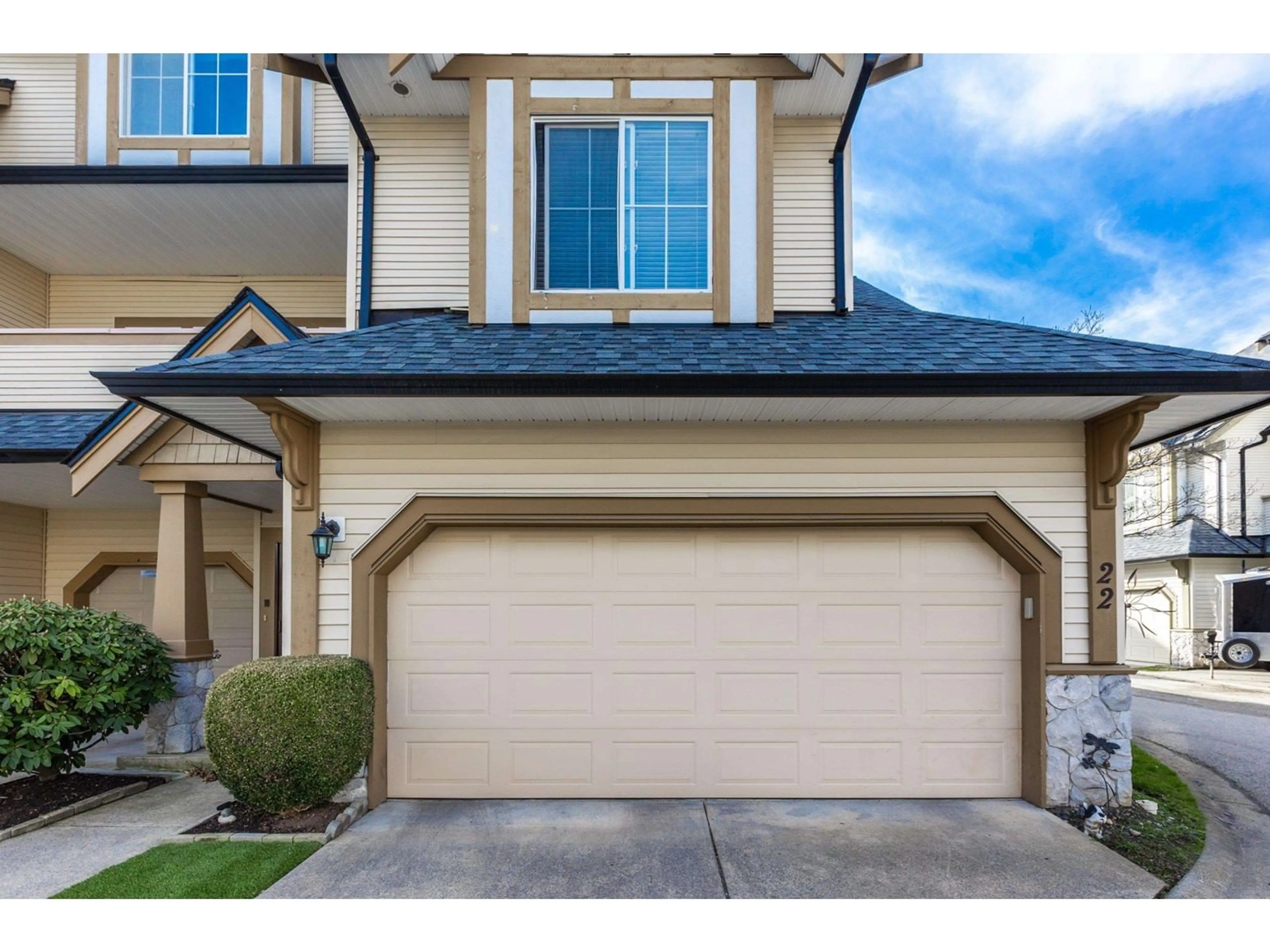 Home with vinyl exterior material, street for 22 18707 65 AVENUE, Surrey British Columbia V3S9H2