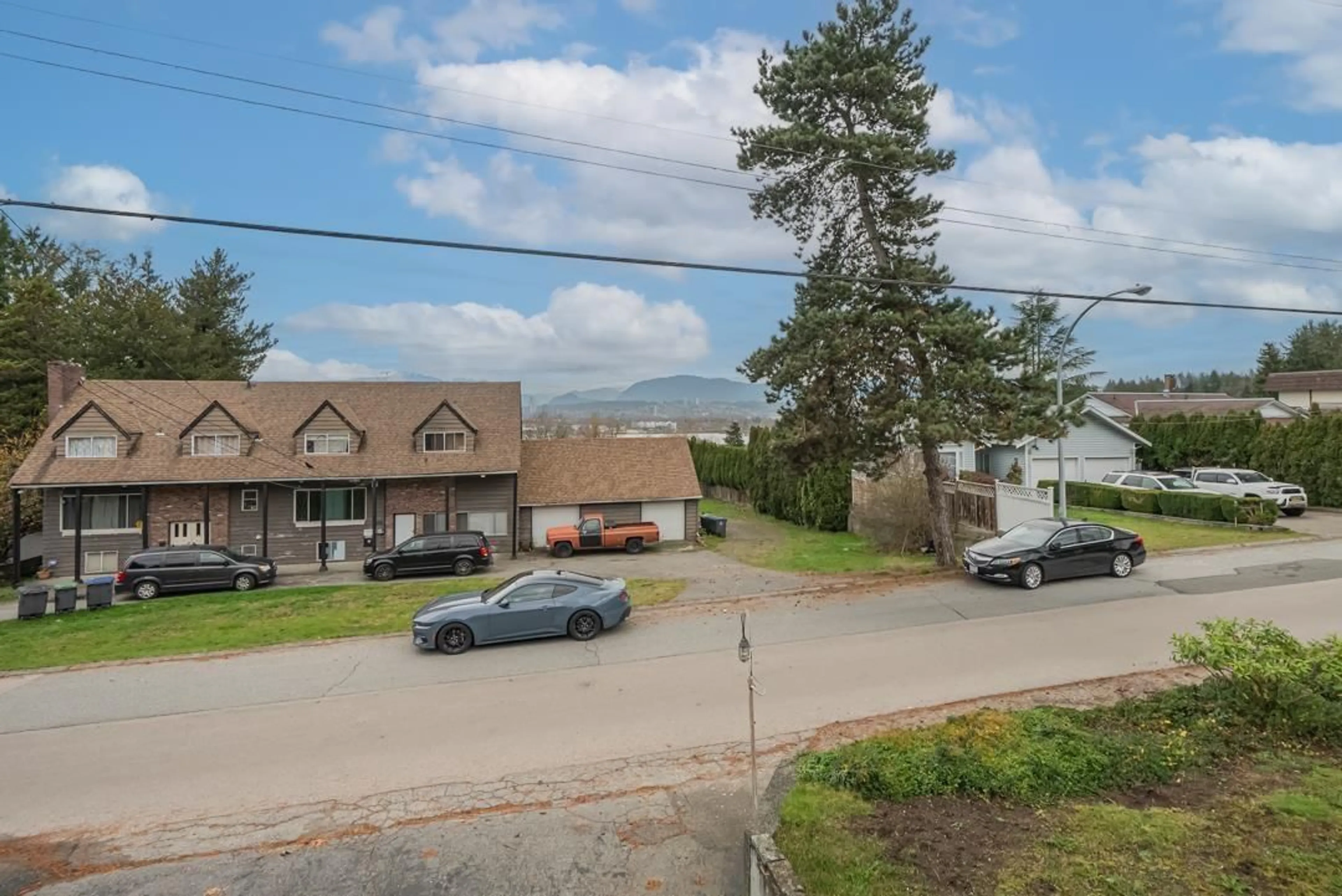 A pic from outside/outdoor area/front of a property/back of a property/a pic from drone, mountain view for 12164 101A AVENUE, Surrey British Columbia V3V3A1