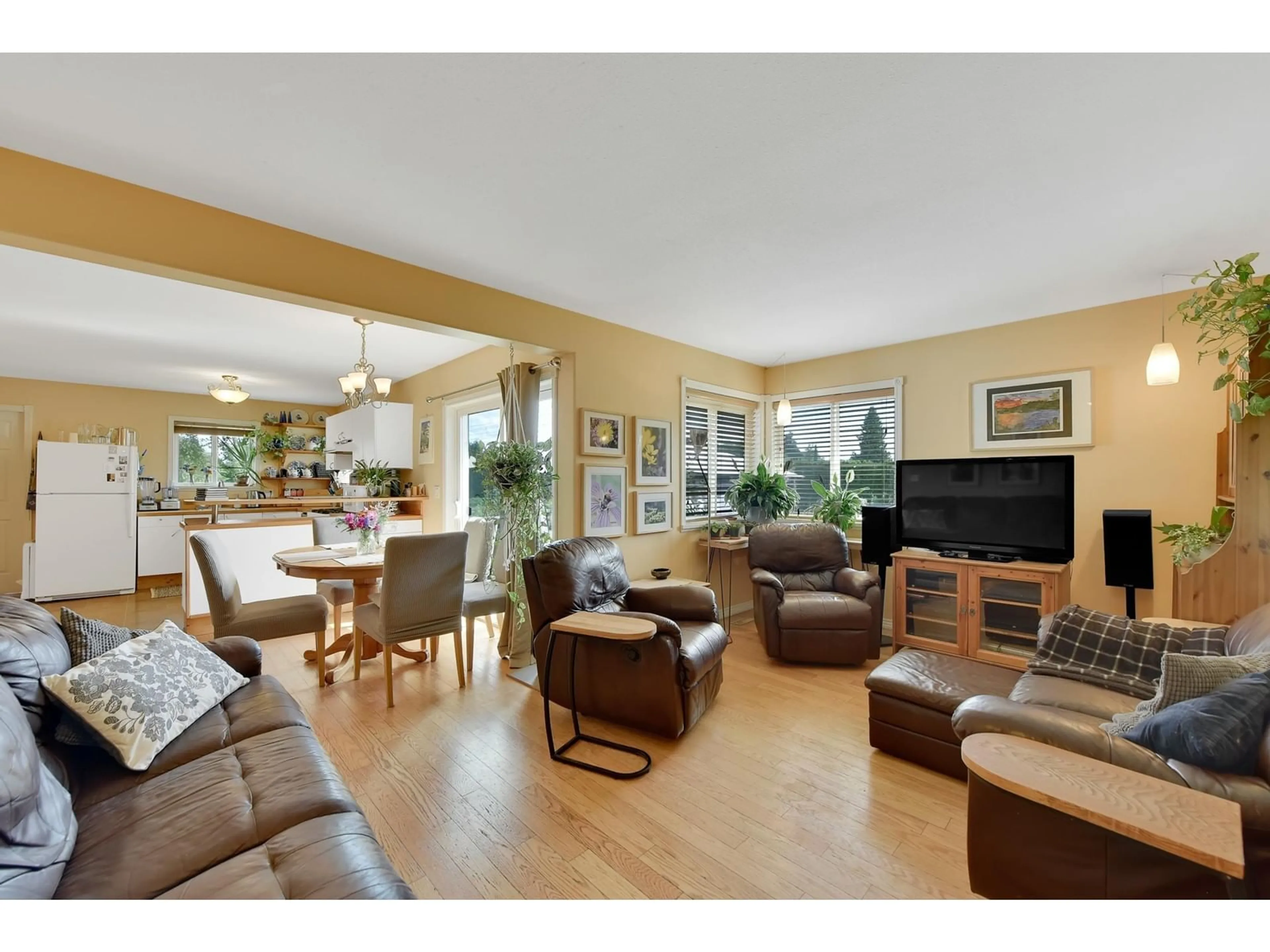 Living room with furniture, wood/laminate floor for 8956 128ST STREET, Surrey British Columbia V3V5M7