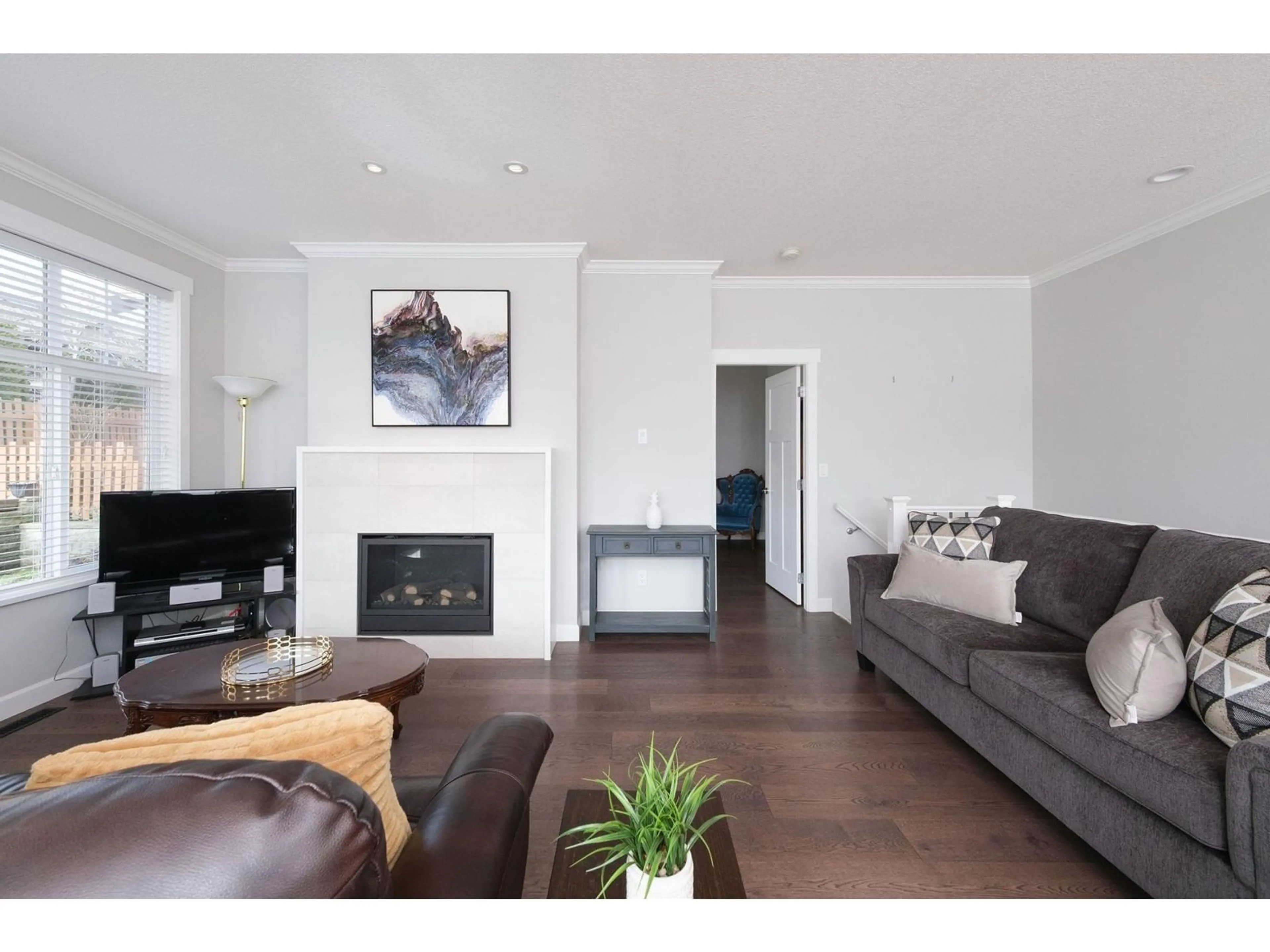 Living room with furniture, wood/laminate floor for 62 7138 210 STREET, Langley British Columbia V2Y0V7