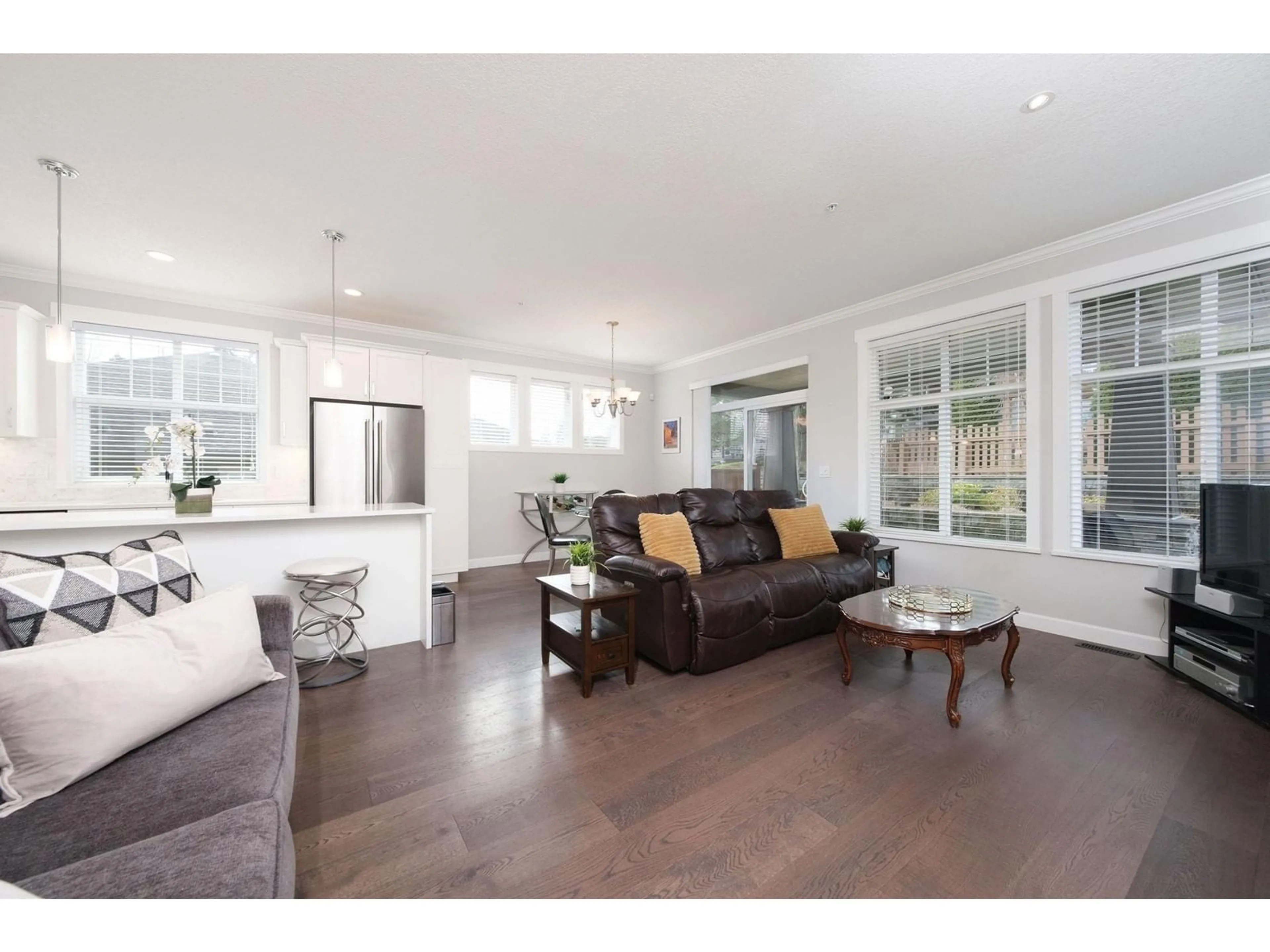 Living room with furniture, wood/laminate floor for 62 7138 210 STREET, Langley British Columbia V2Y0V7