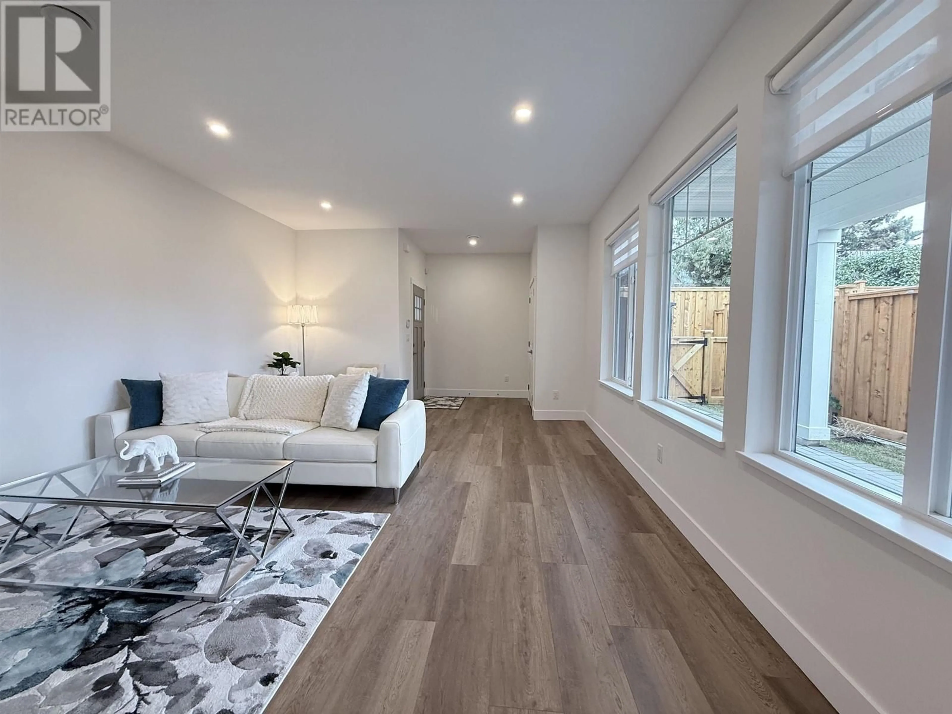 Living room with furniture, wood/laminate floor for 103 361 MARMONT STREET, Coquitlam British Columbia V3K4R5