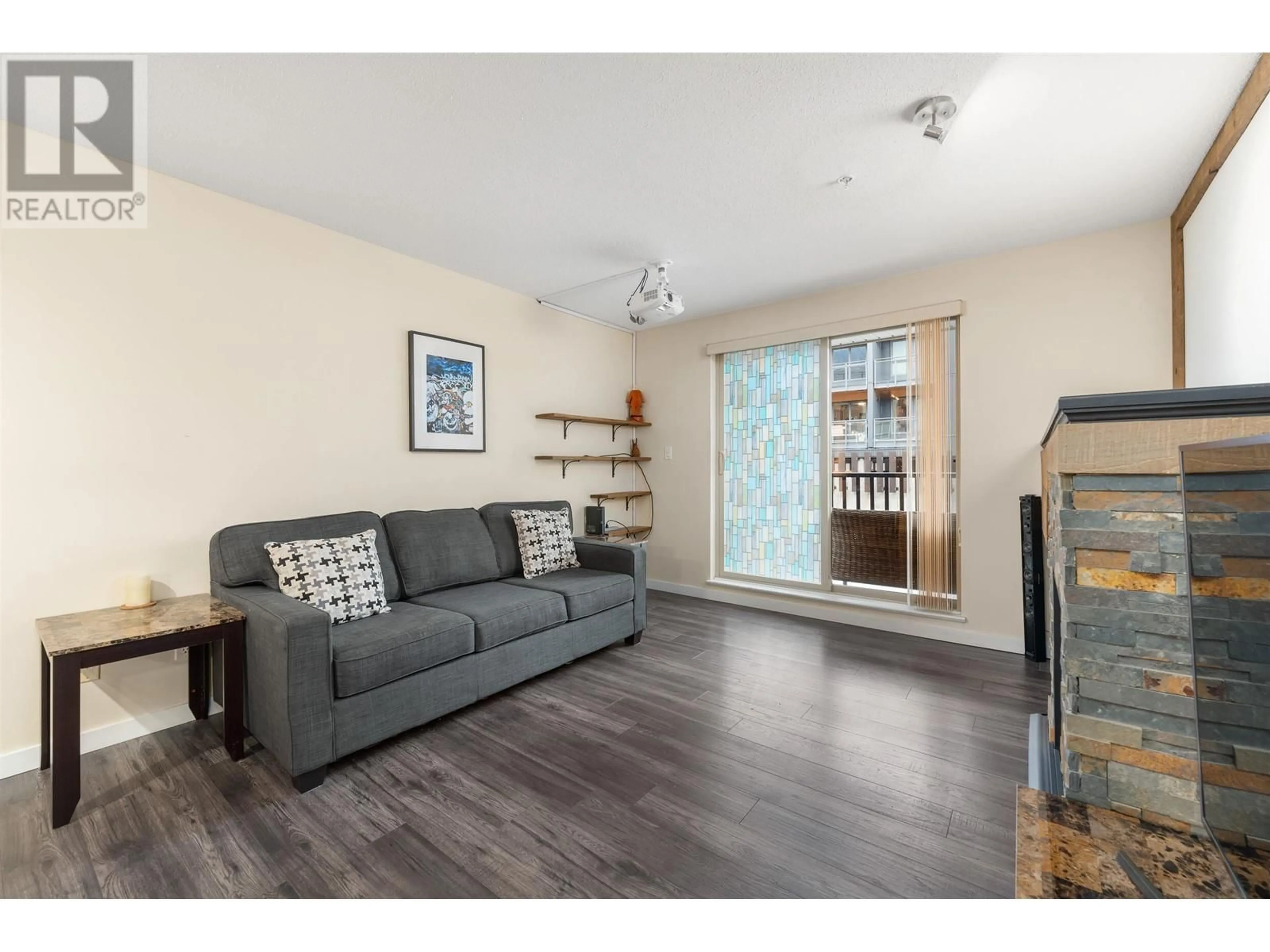 Living room with furniture, wood/laminate floor for 109 - 38003 SECOND AVENUE, Squamish British Columbia V8B0C4