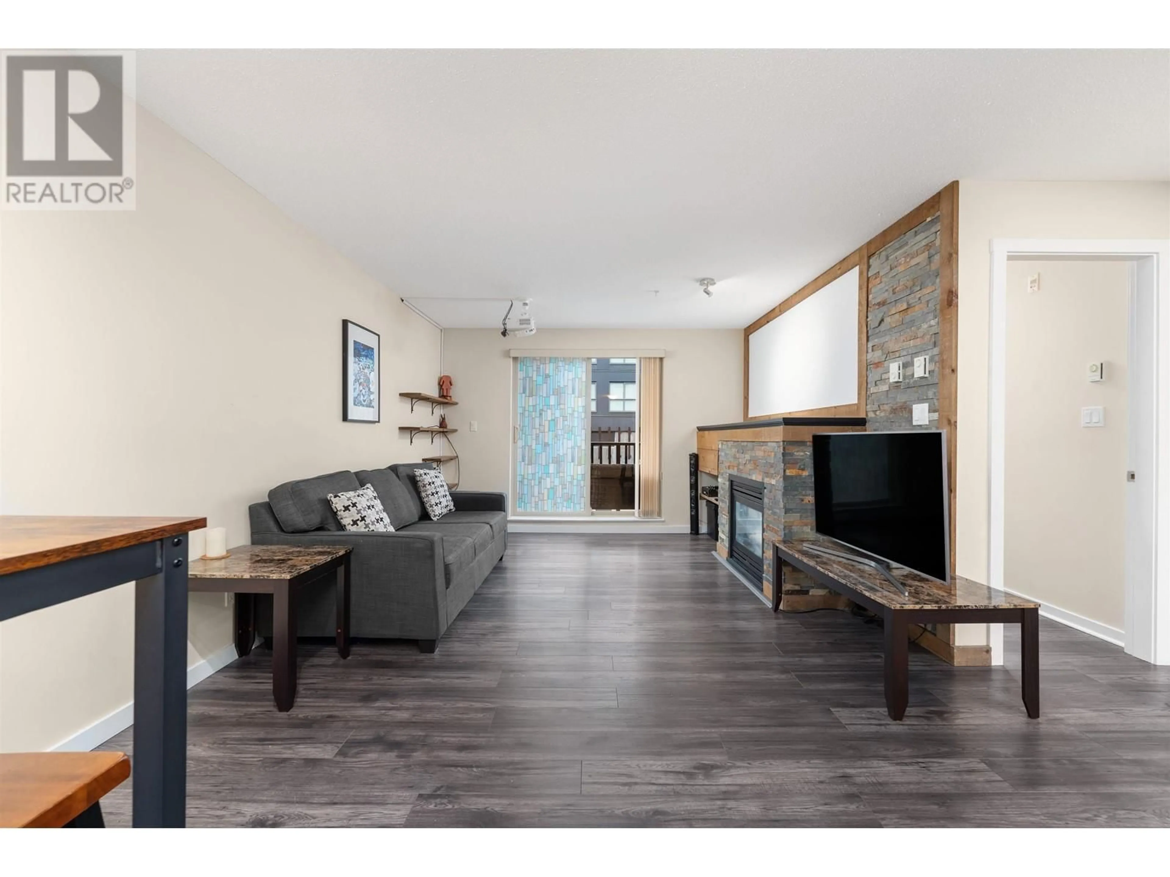 Living room with furniture, wood/laminate floor for 109 - 38003 SECOND AVENUE, Squamish British Columbia V8B0C4