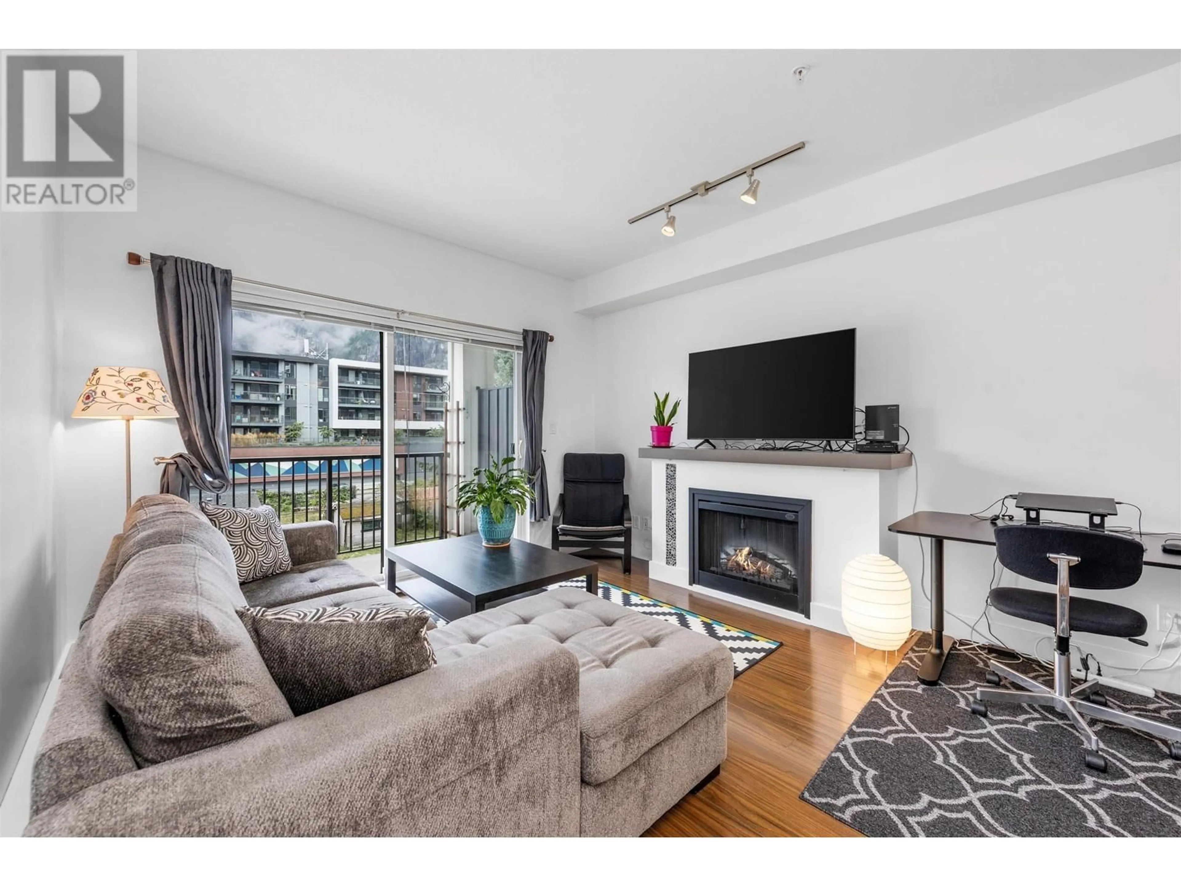 Living room with furniture, wood/laminate floor for 309 1336 MAIN STREET, Squamish British Columbia V8B0R2