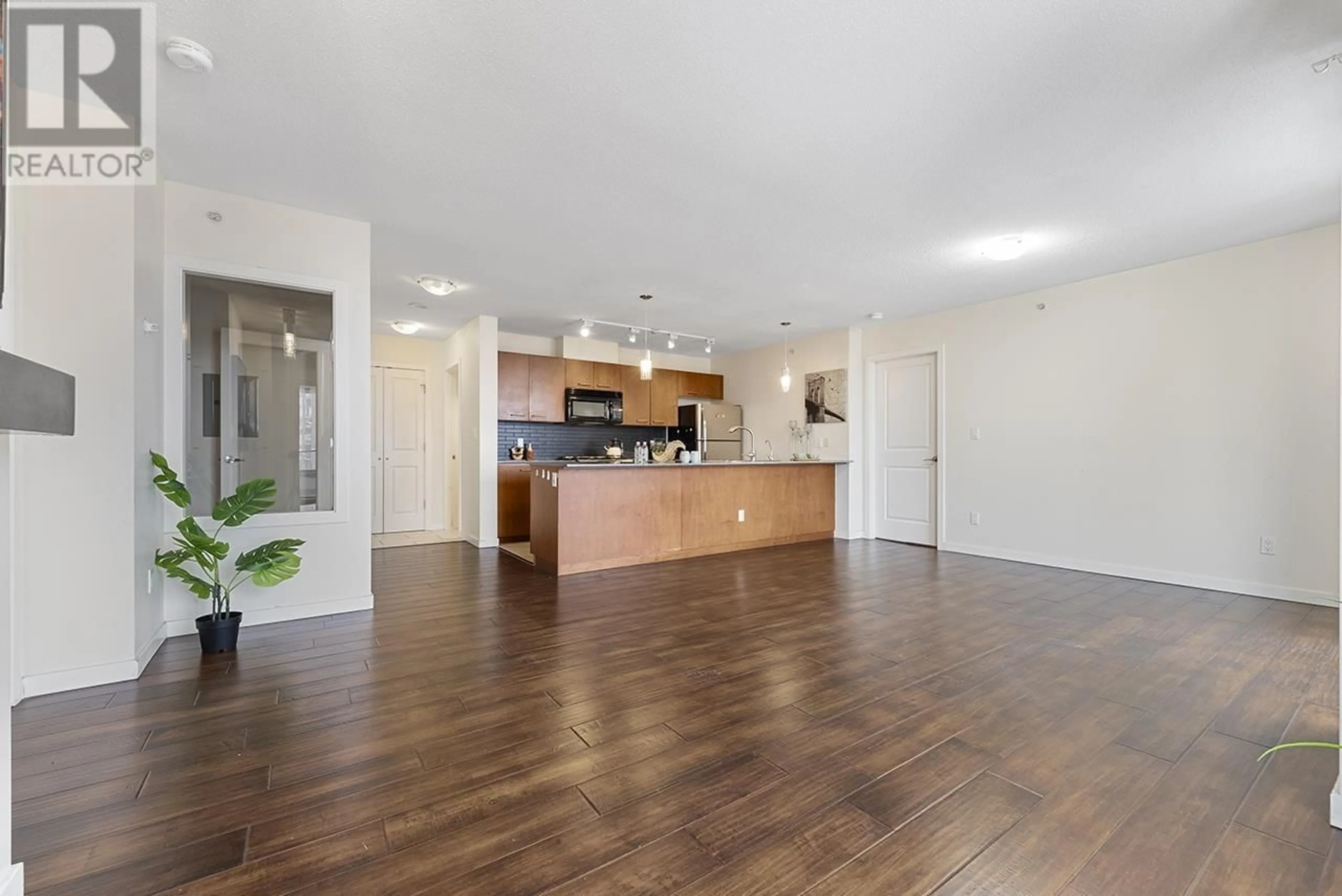 Open concept kitchen, wood/laminate floor for 1503 4333 CENTRAL BOULEVARD, Burnaby British Columbia V5H4W8