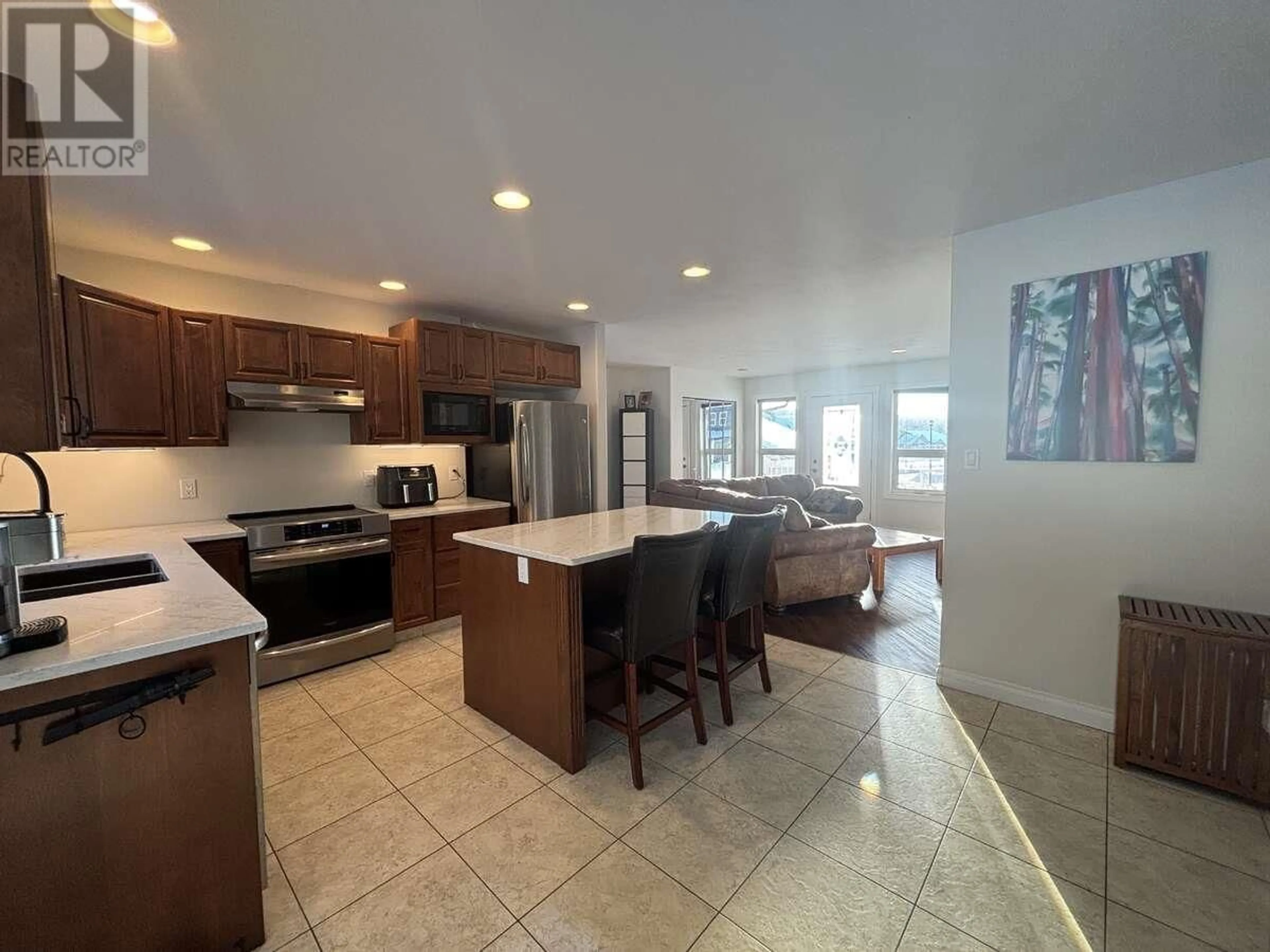 Open concept kitchen, ceramic/tile floor for 211 NICKEL RIDGE AVENUE, Quesnel British Columbia V2J6P6