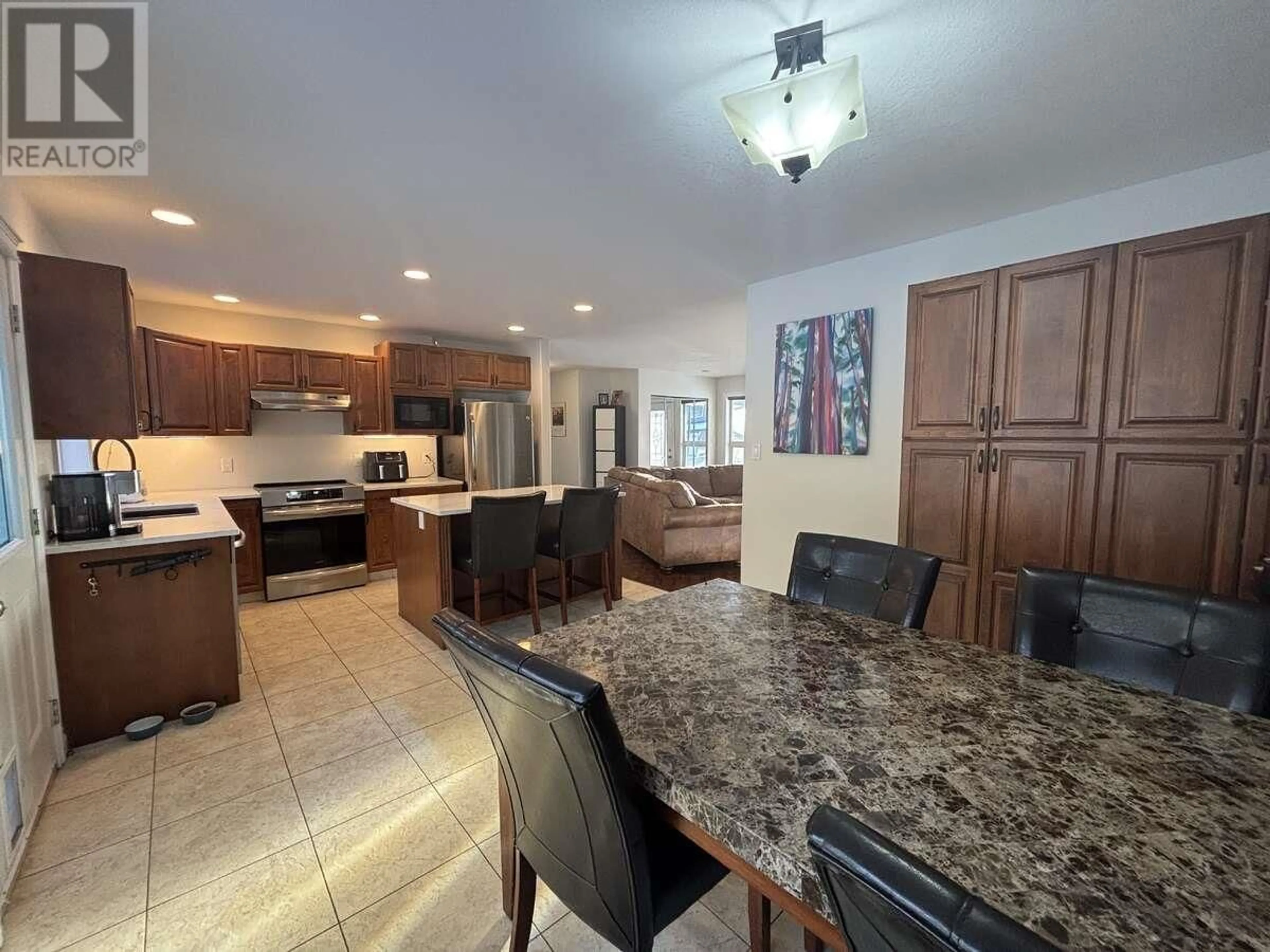 Open concept kitchen, ceramic/tile floor for 211 NICKEL RIDGE AVENUE, Quesnel British Columbia V2J6P6