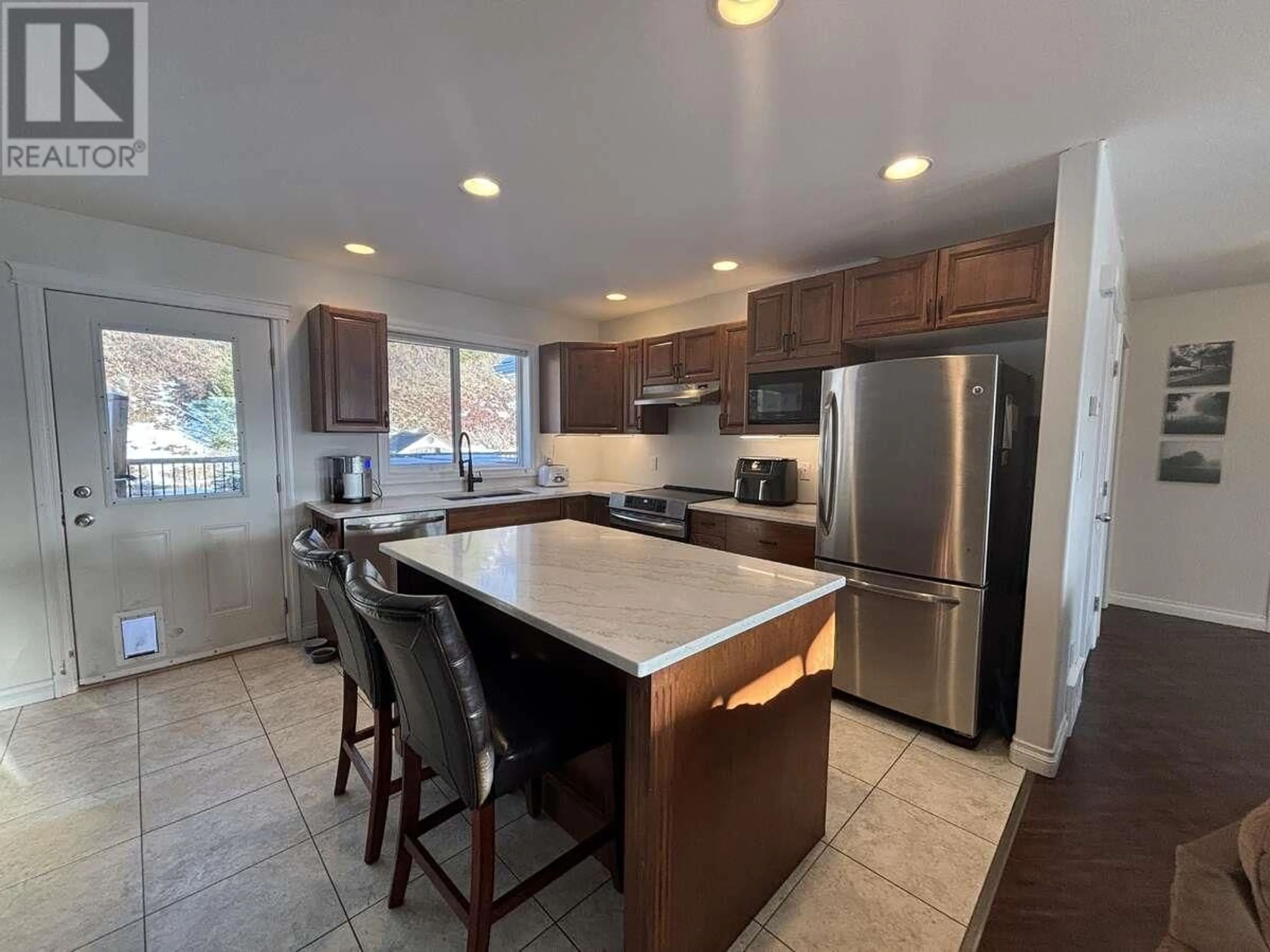 Open concept kitchen, ceramic/tile floor for 211 NICKEL RIDGE AVENUE, Quesnel British Columbia V2J6P6