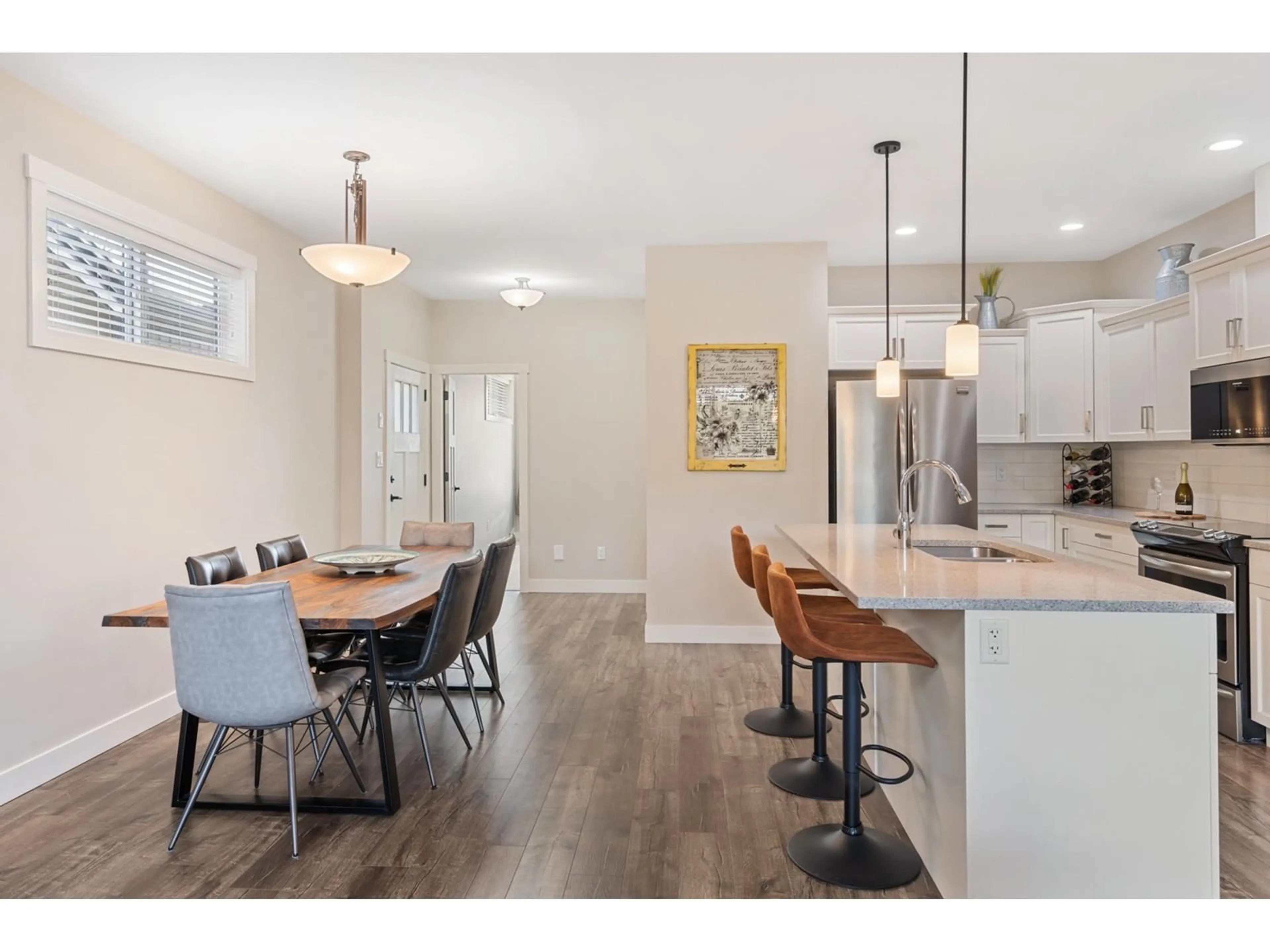 Open concept kitchen, wood/laminate floor for 10 - 7319 MORROW ROAD, Agassiz British Columbia V0M1A2