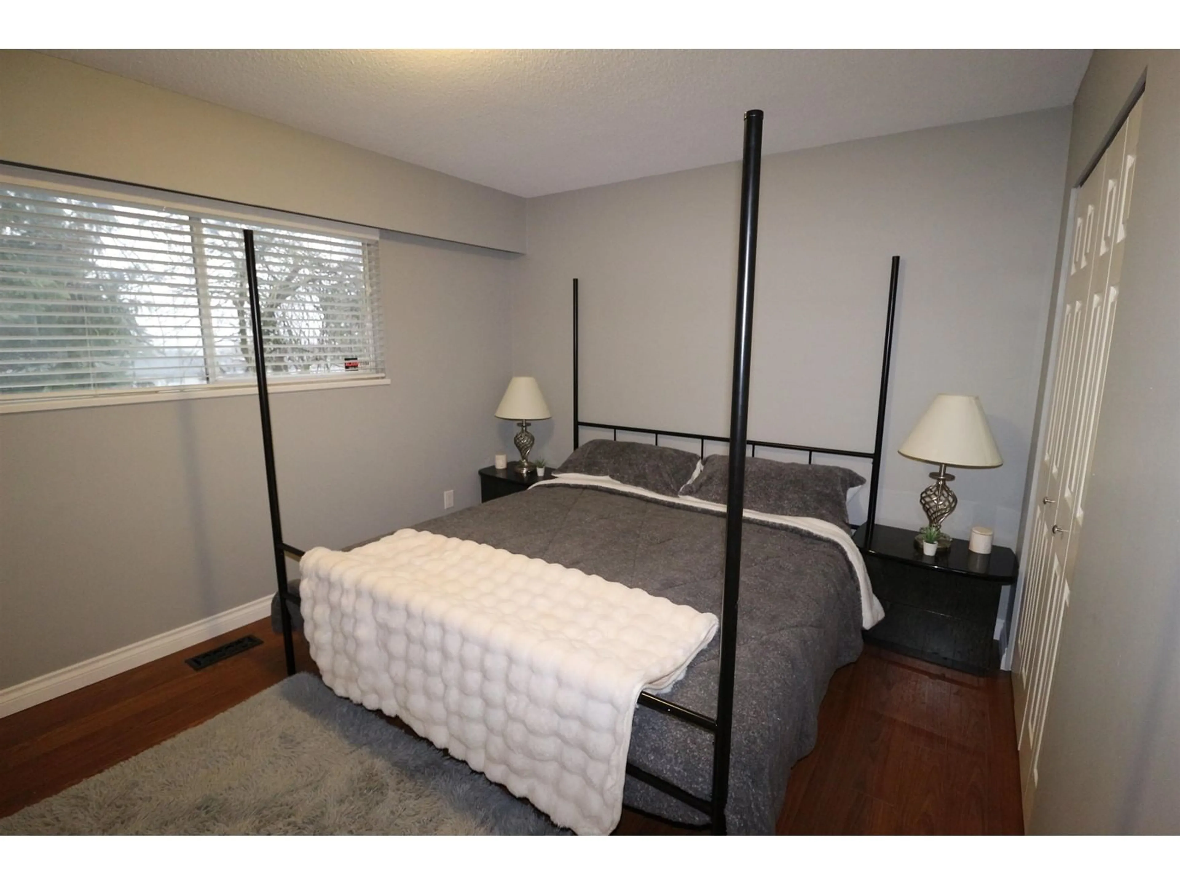 Bedroom with bed, wood/laminate floor for 32724 MCRAE AVENUE, Mission British Columbia V2V2L9